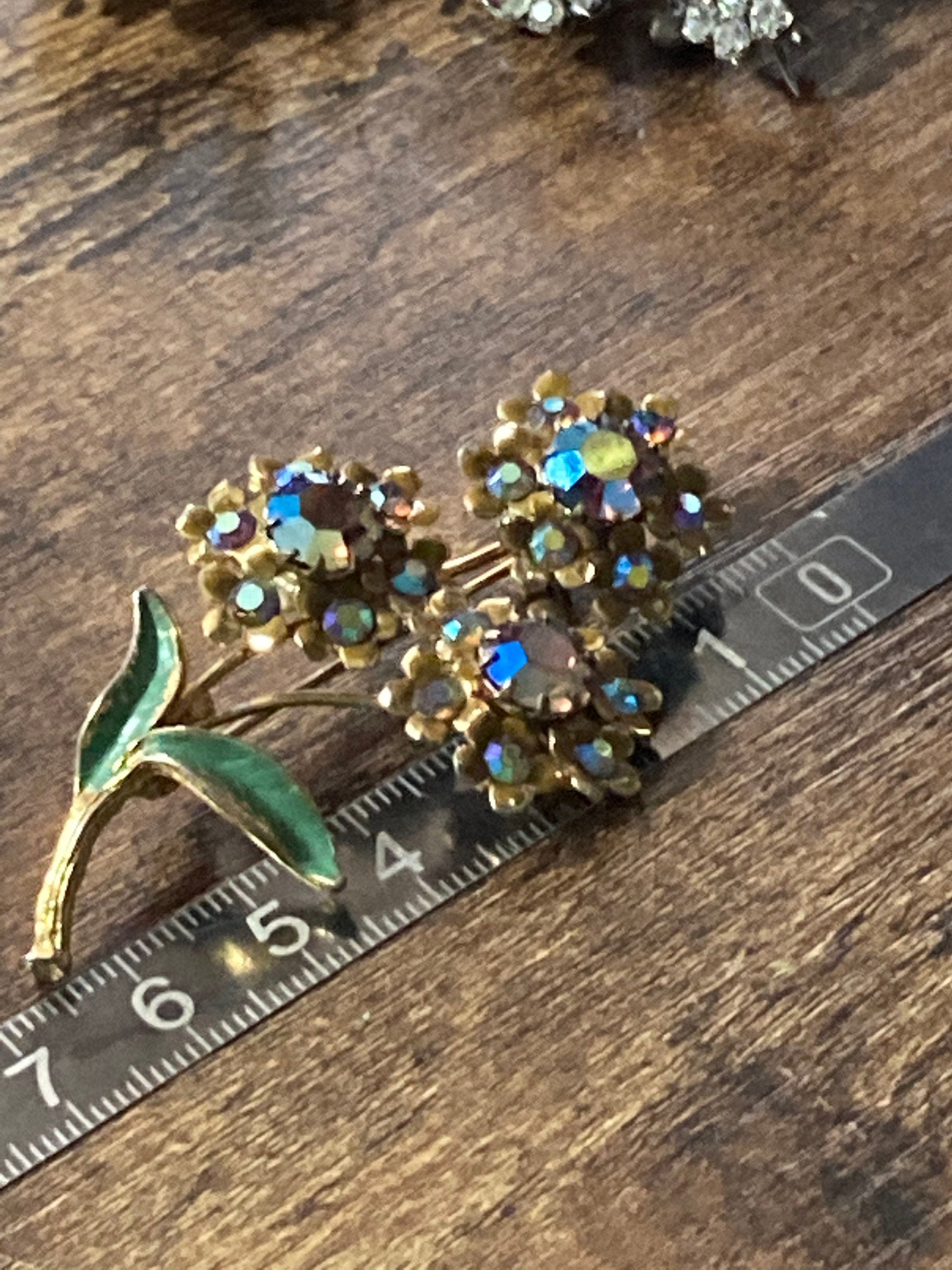 Vintage Aurora Borealis Rhinestone Flower Brooch: Gold Tone Enamel Leaves