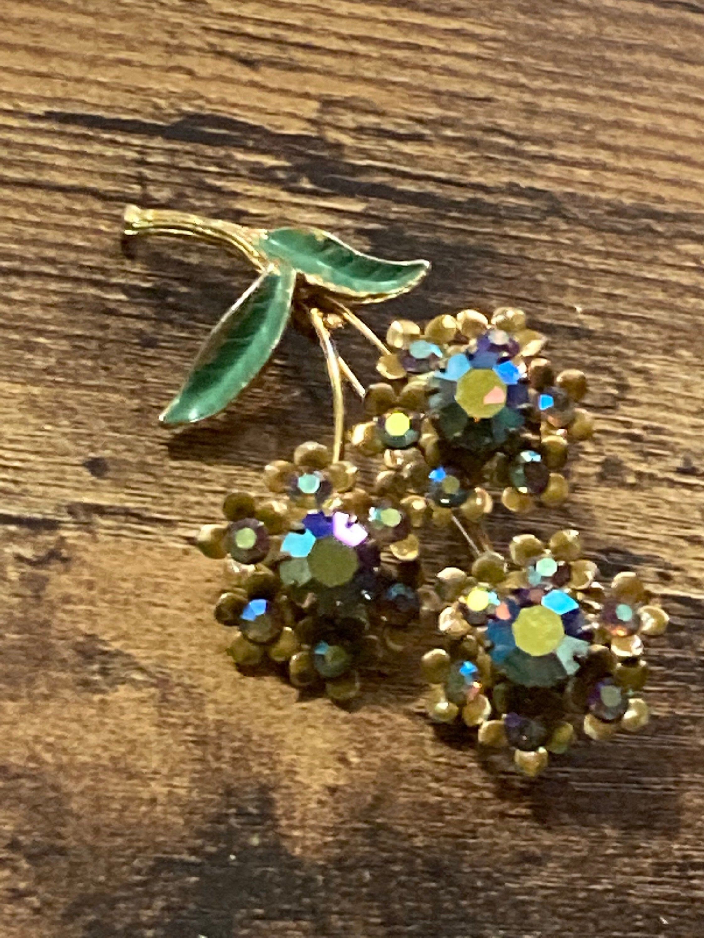 Vintage Aurora Borealis Rhinestone Flower Brooch: Gold Tone Enamel Leaves