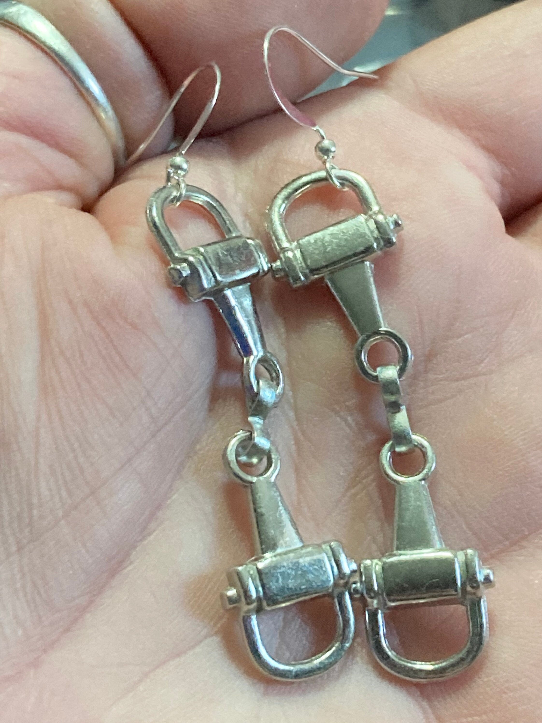 Pair of silver tone snaffle stirrup link 6cm drop earrings