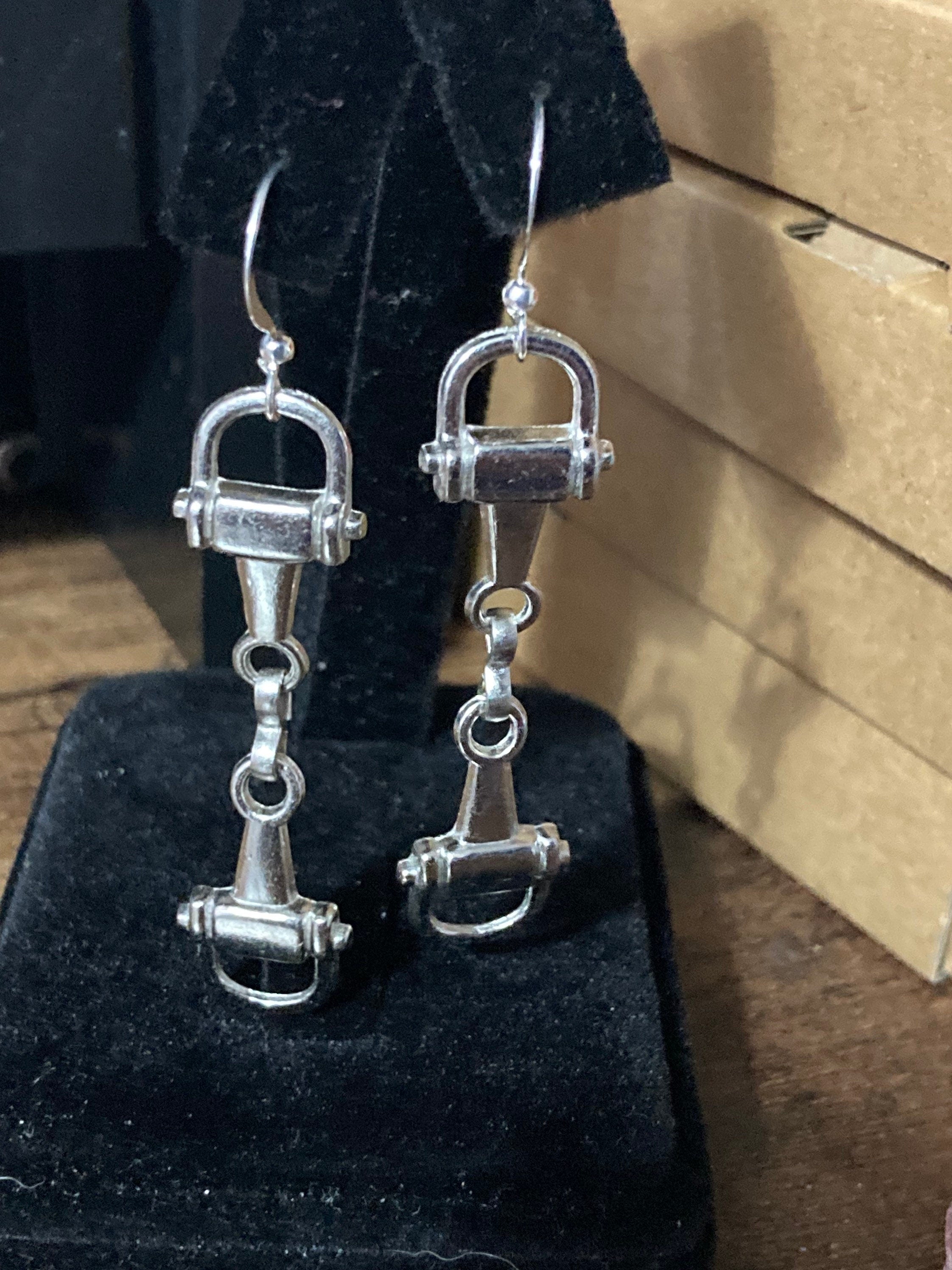 Pair of silver tone snaffle stirrup link 6cm drop earrings