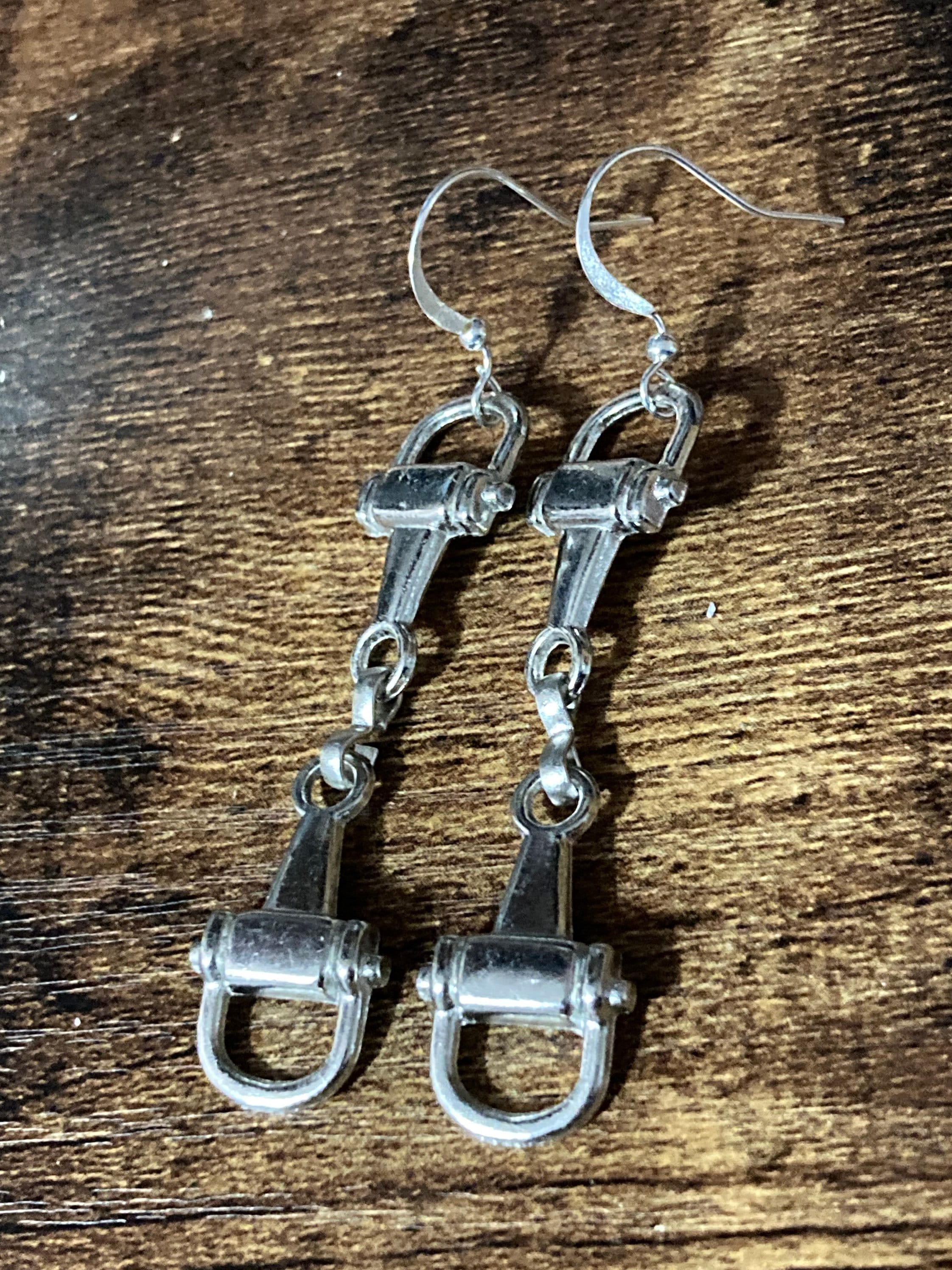 Pair of silver tone snaffle stirrup link 6cm drop earrings