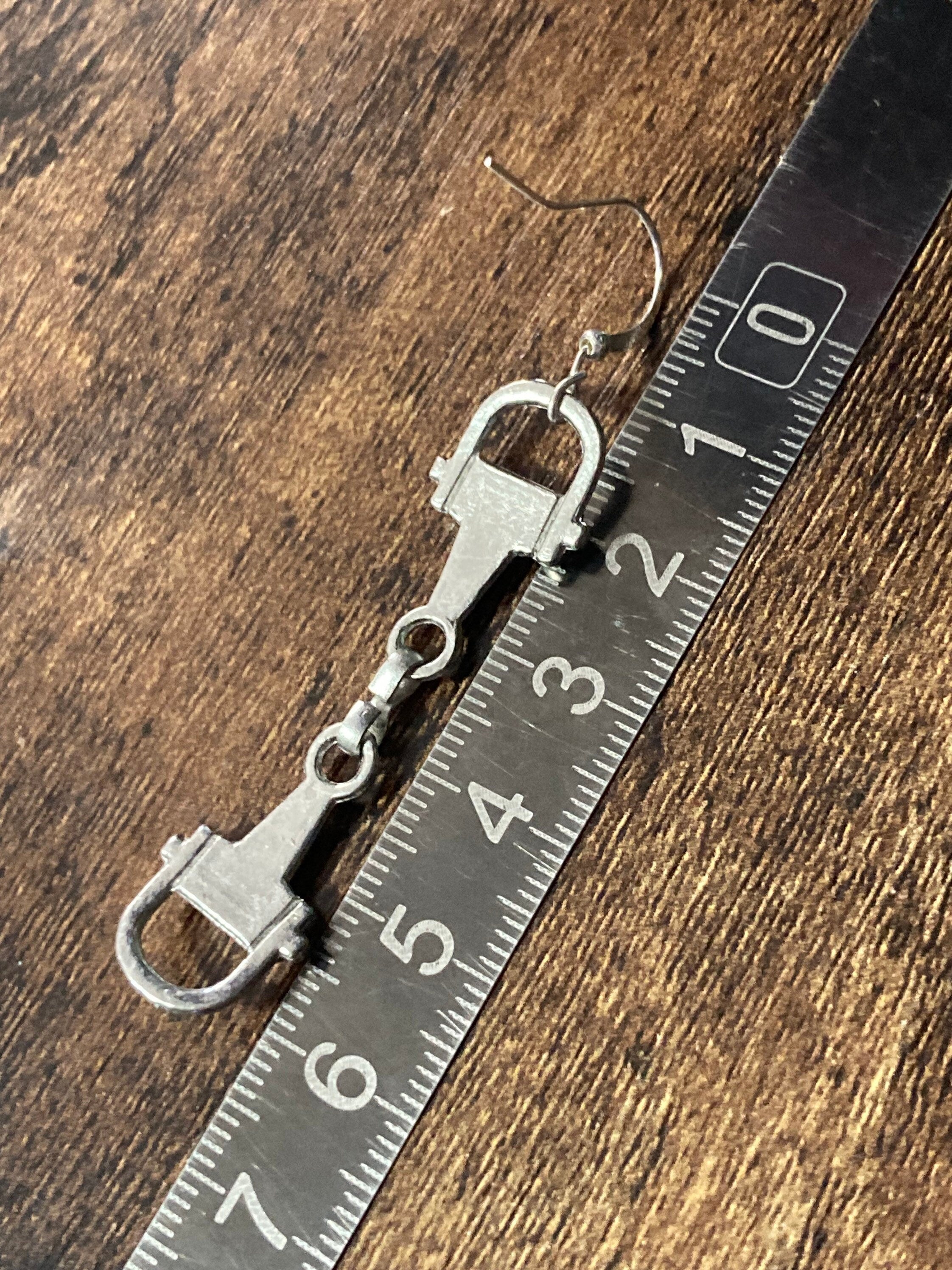 Pair of silver tone snaffle stirrup link 6cm drop earrings