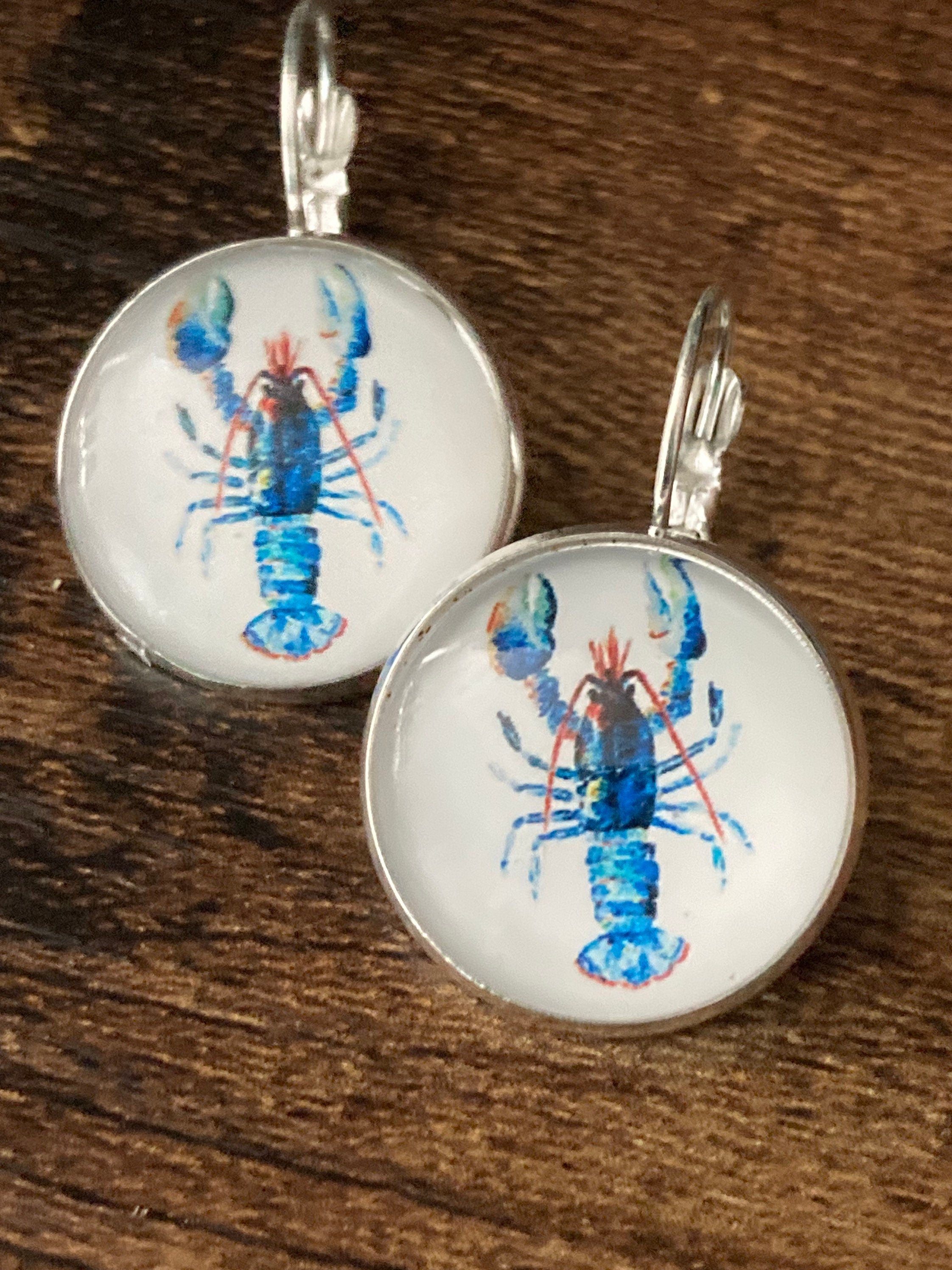 Silver tone Blue glass domed lobster earrings