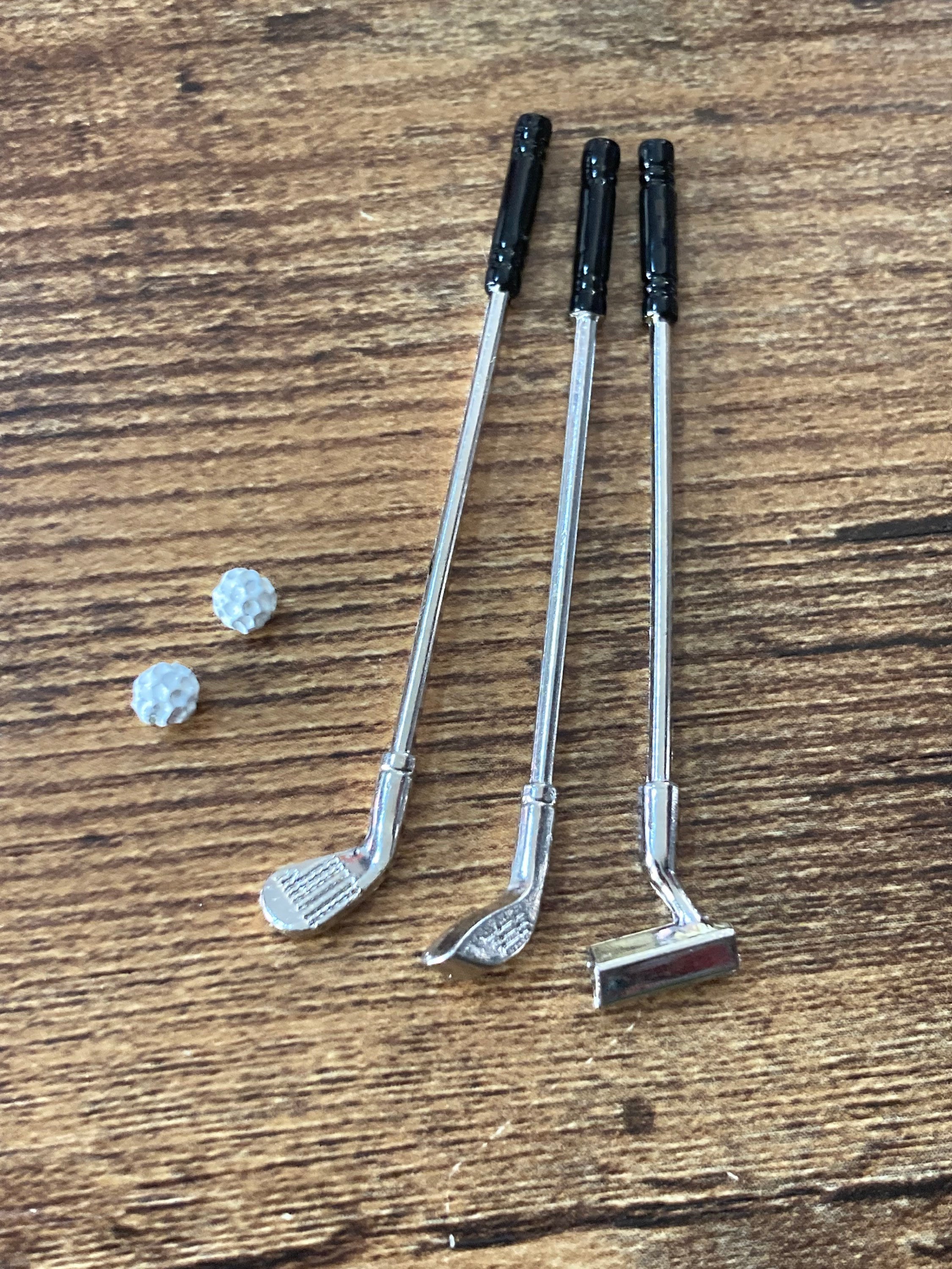 Miniature set of three golf clubs and two balls cake topper decoration or dollhouse