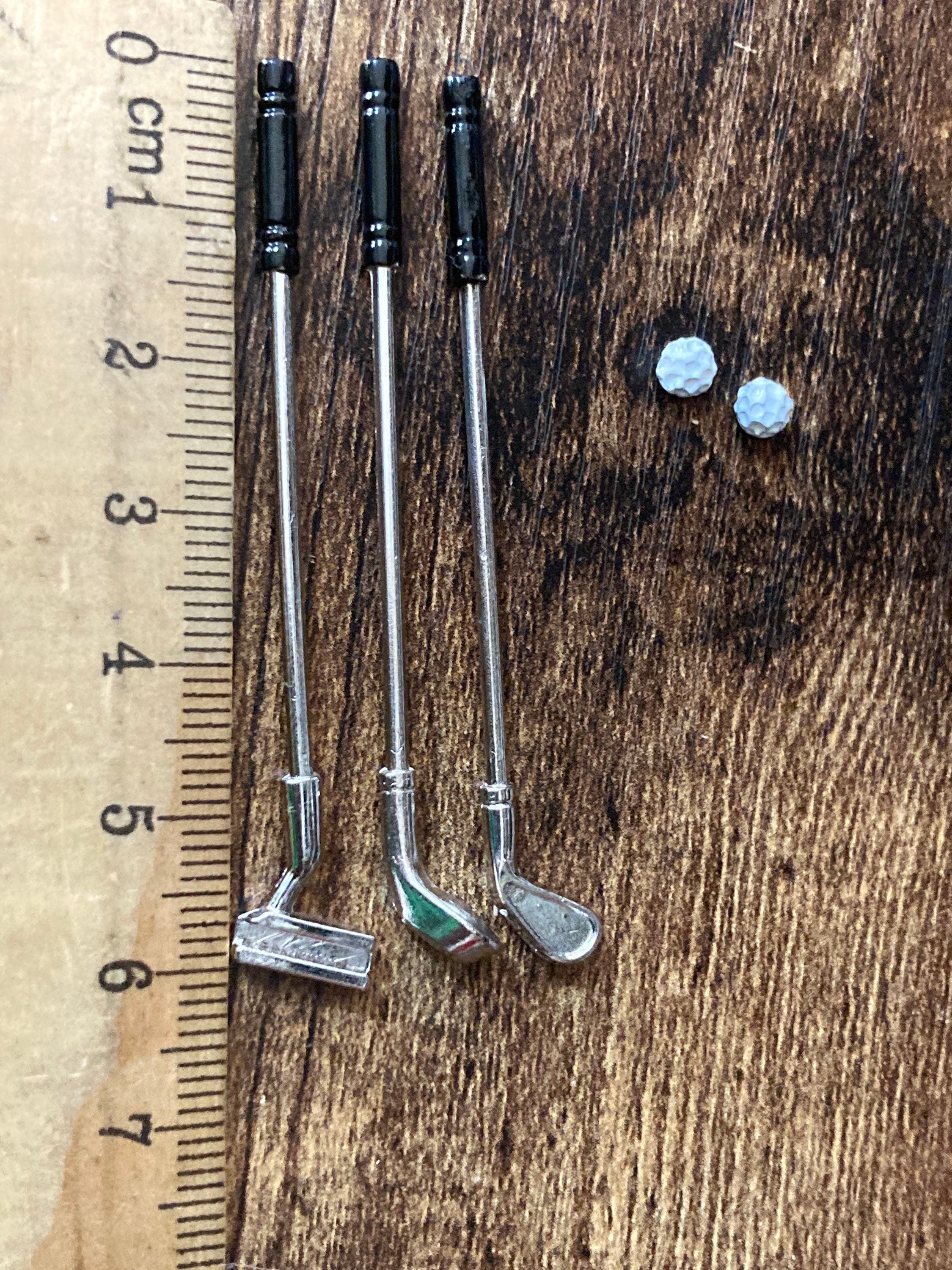 Miniature set of three golf clubs and two balls cake topper decoration or dollhouse
