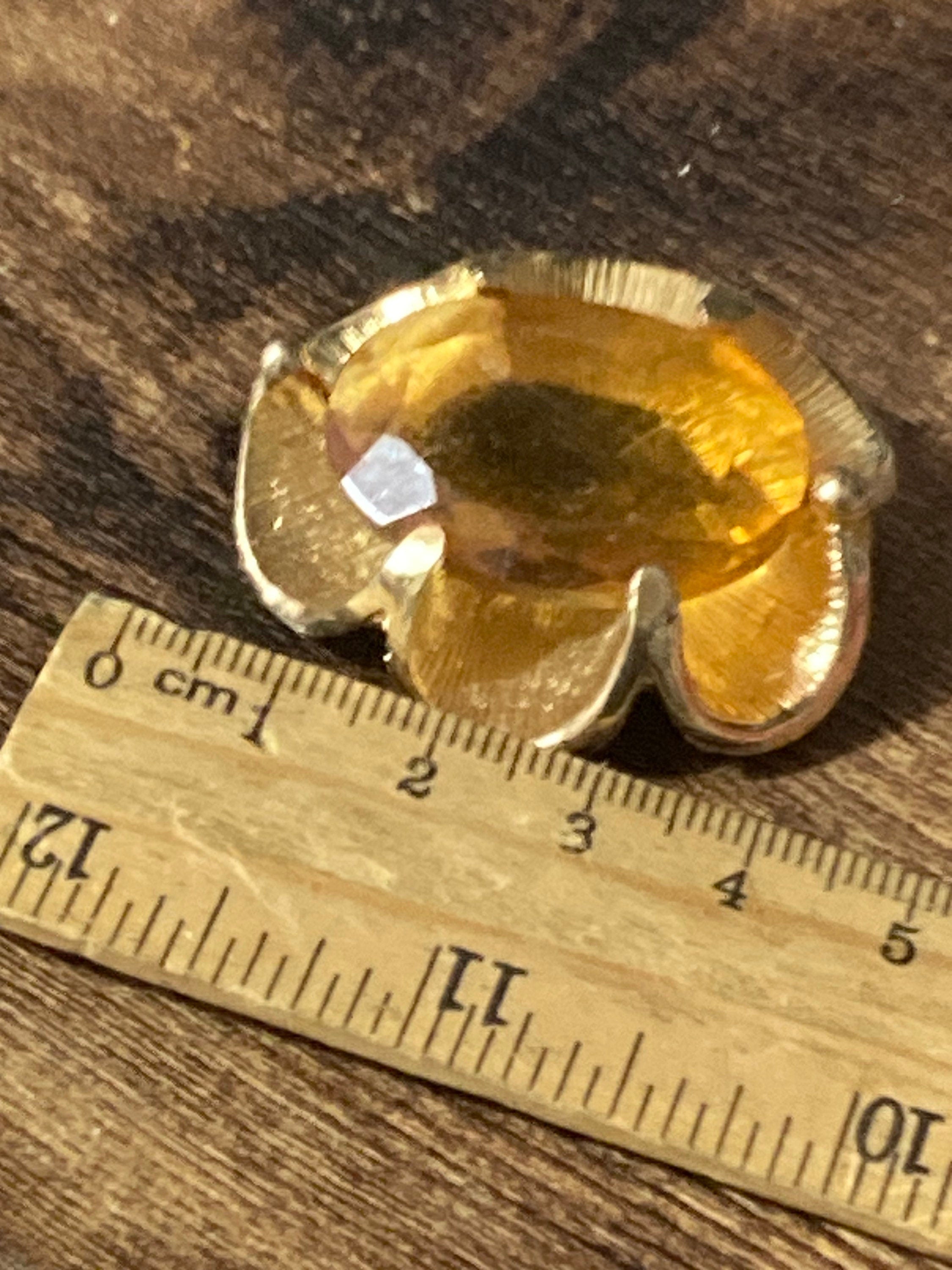 Vintage oversized chunky gold tone brooch with large orange citrine glass cabochon