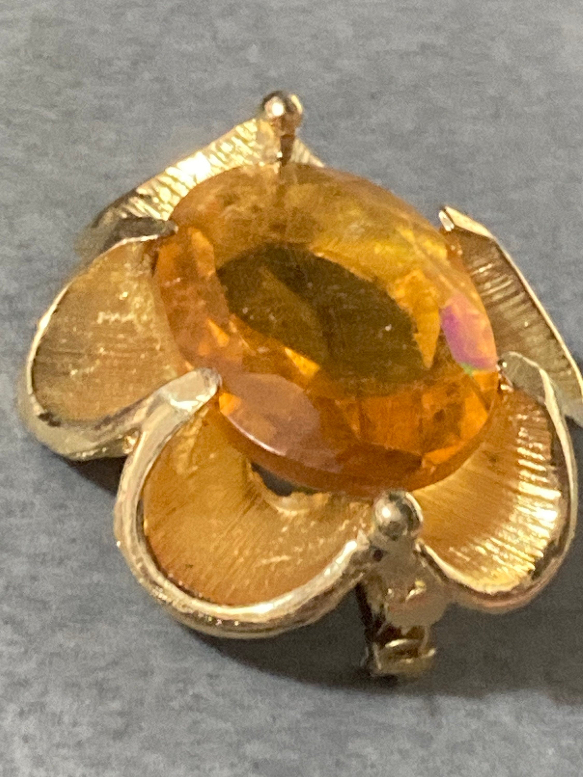 Vintage oversized chunky gold tone brooch with large orange citrine glass cabochon