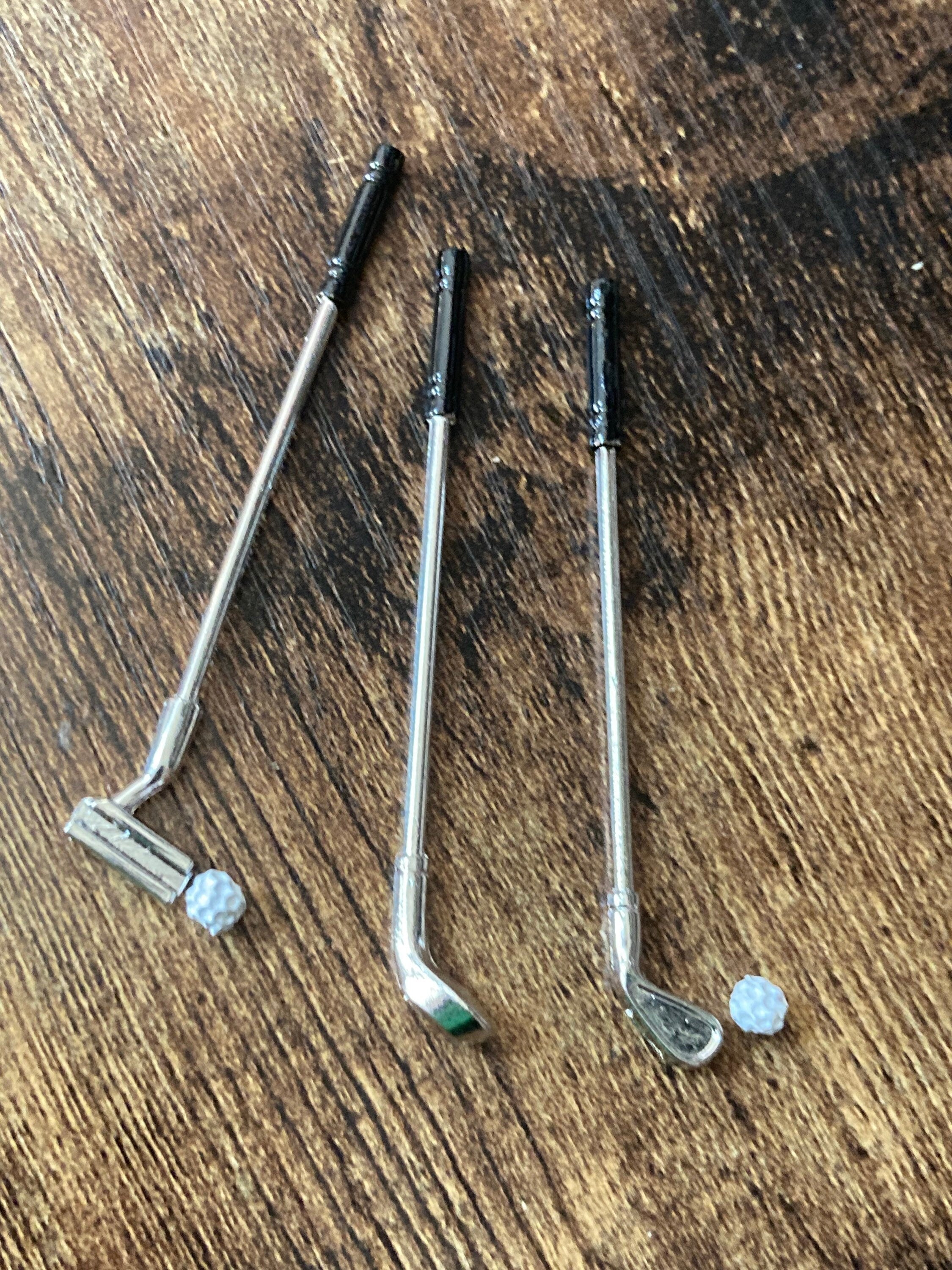 Miniature set of three golf clubs and two balls cake topper decoration or dollhouse
