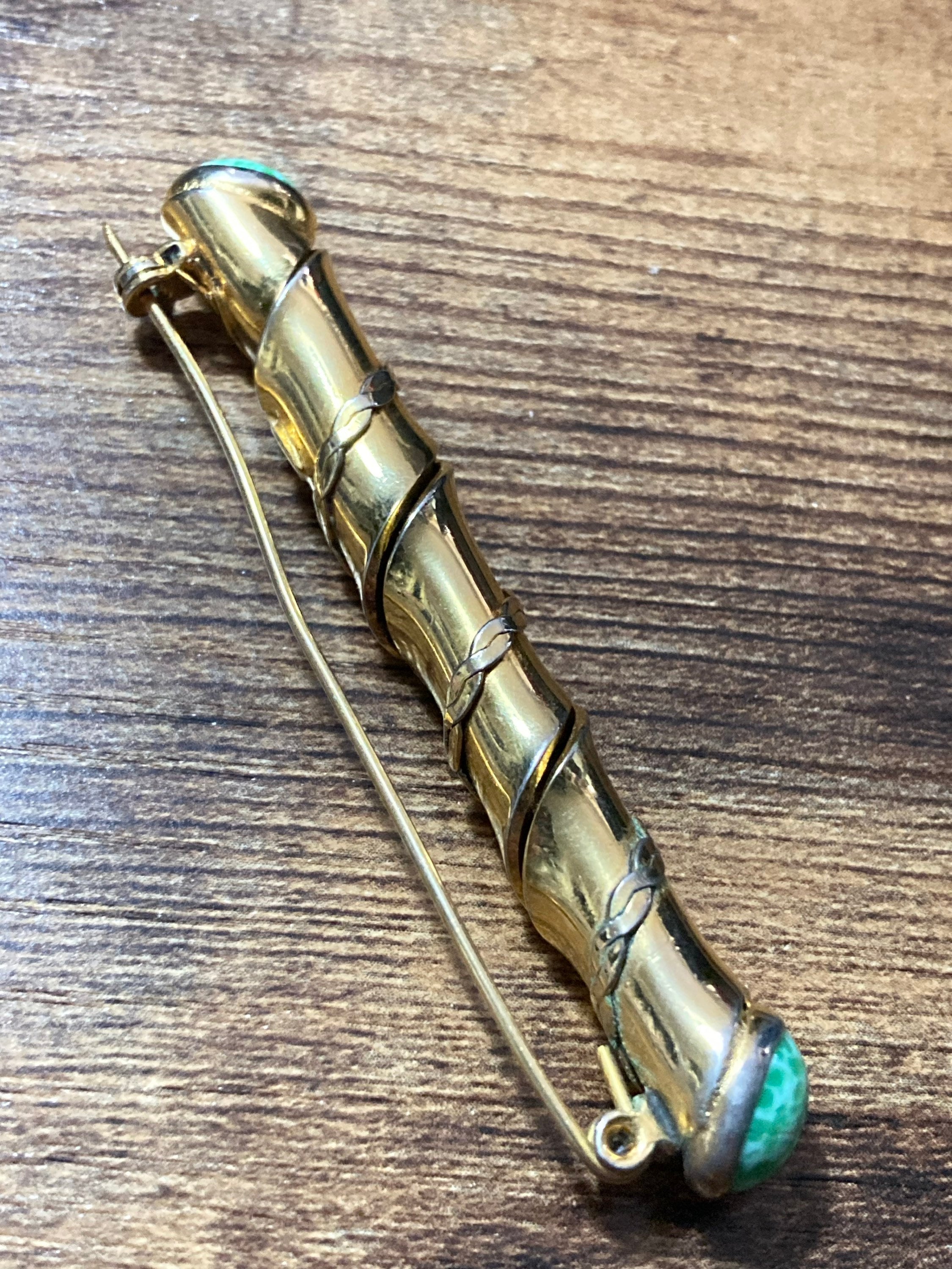 Long gold tone twisted bar Brooch with Peking Glass Ceramic green cabochons