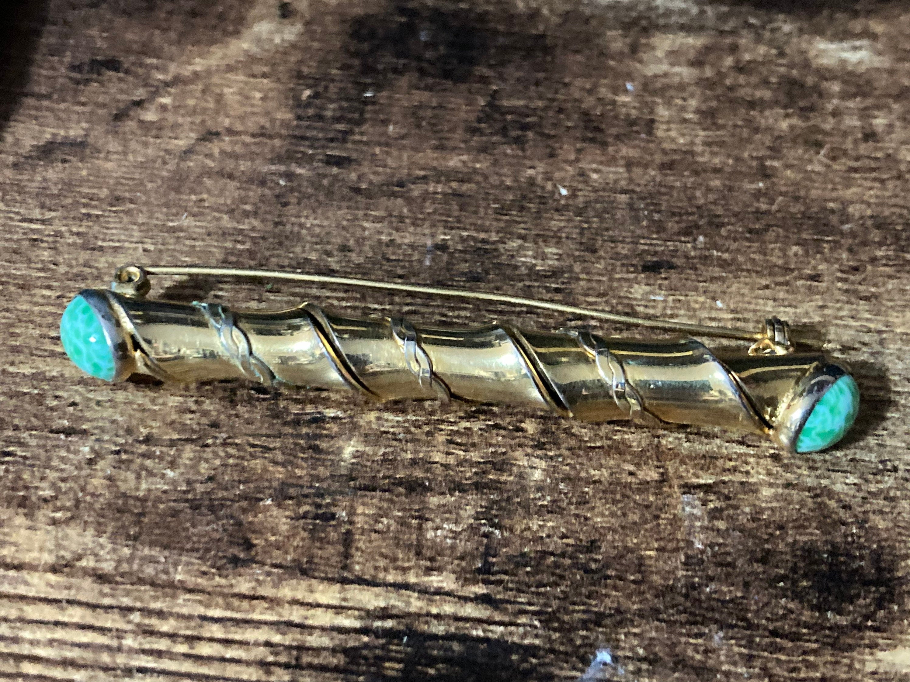 Long gold tone twisted bar Brooch with Peking Glass Ceramic green cabochons