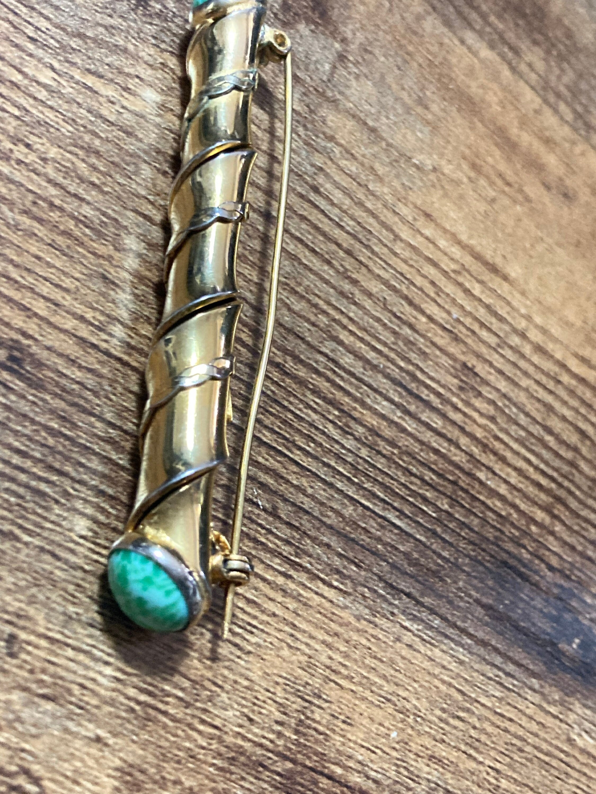 Long gold tone twisted bar Brooch with Peking Glass Ceramic green cabochons