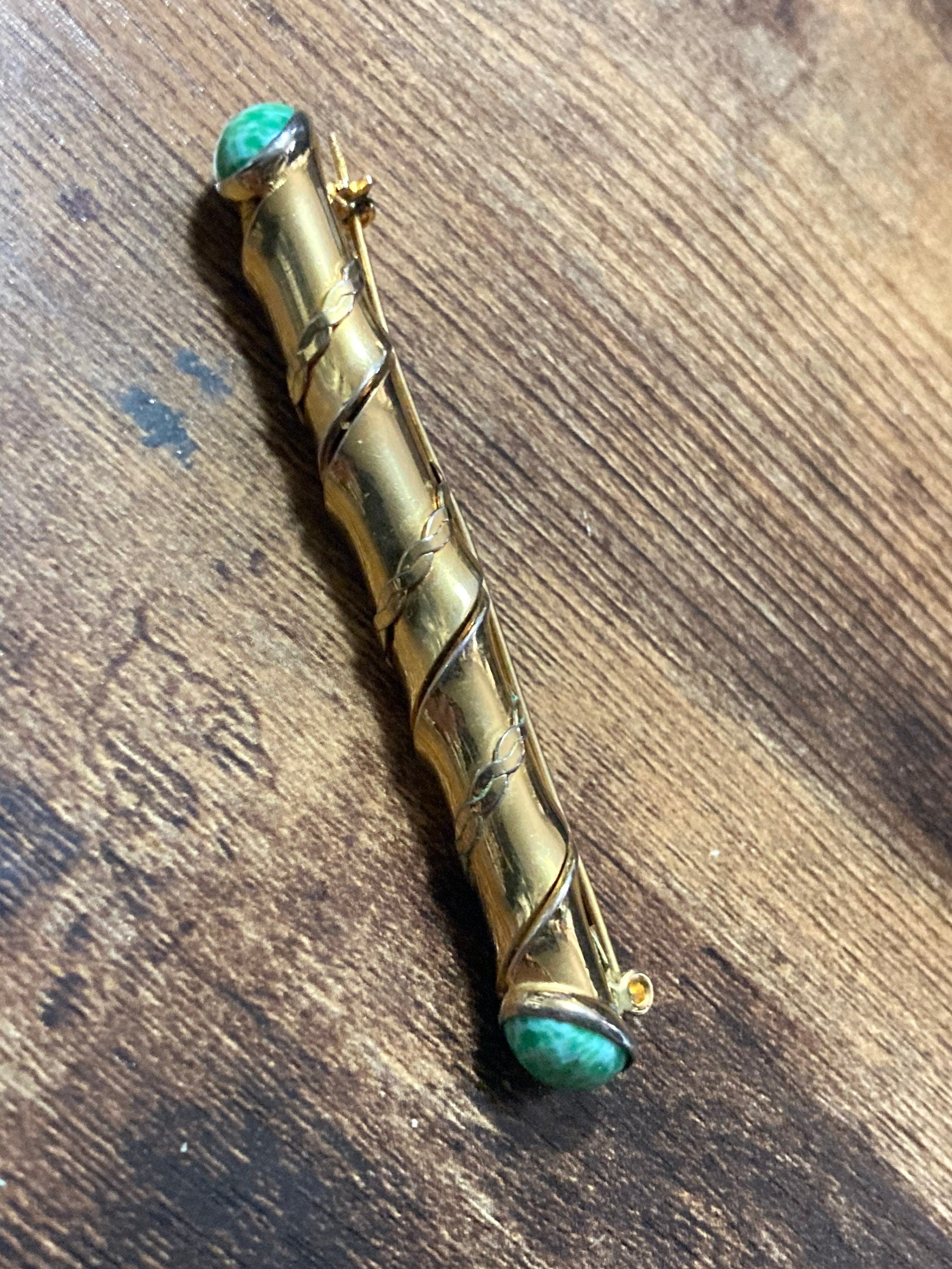 Long gold tone twisted bar Brooch with Peking Glass Ceramic green cabochons