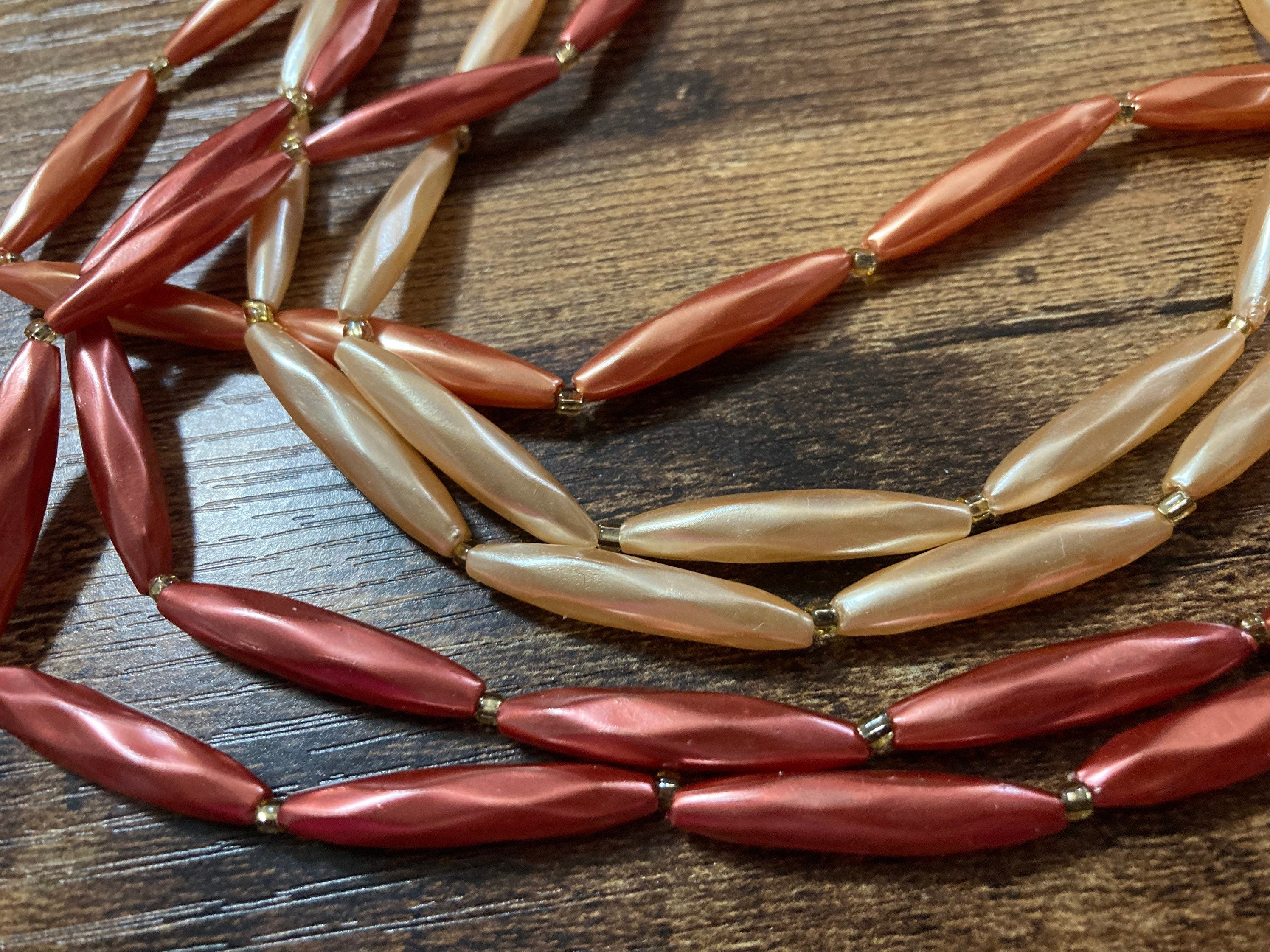 Mid century orange peach pink faux pearl plastic beaded multi strand choker necklace