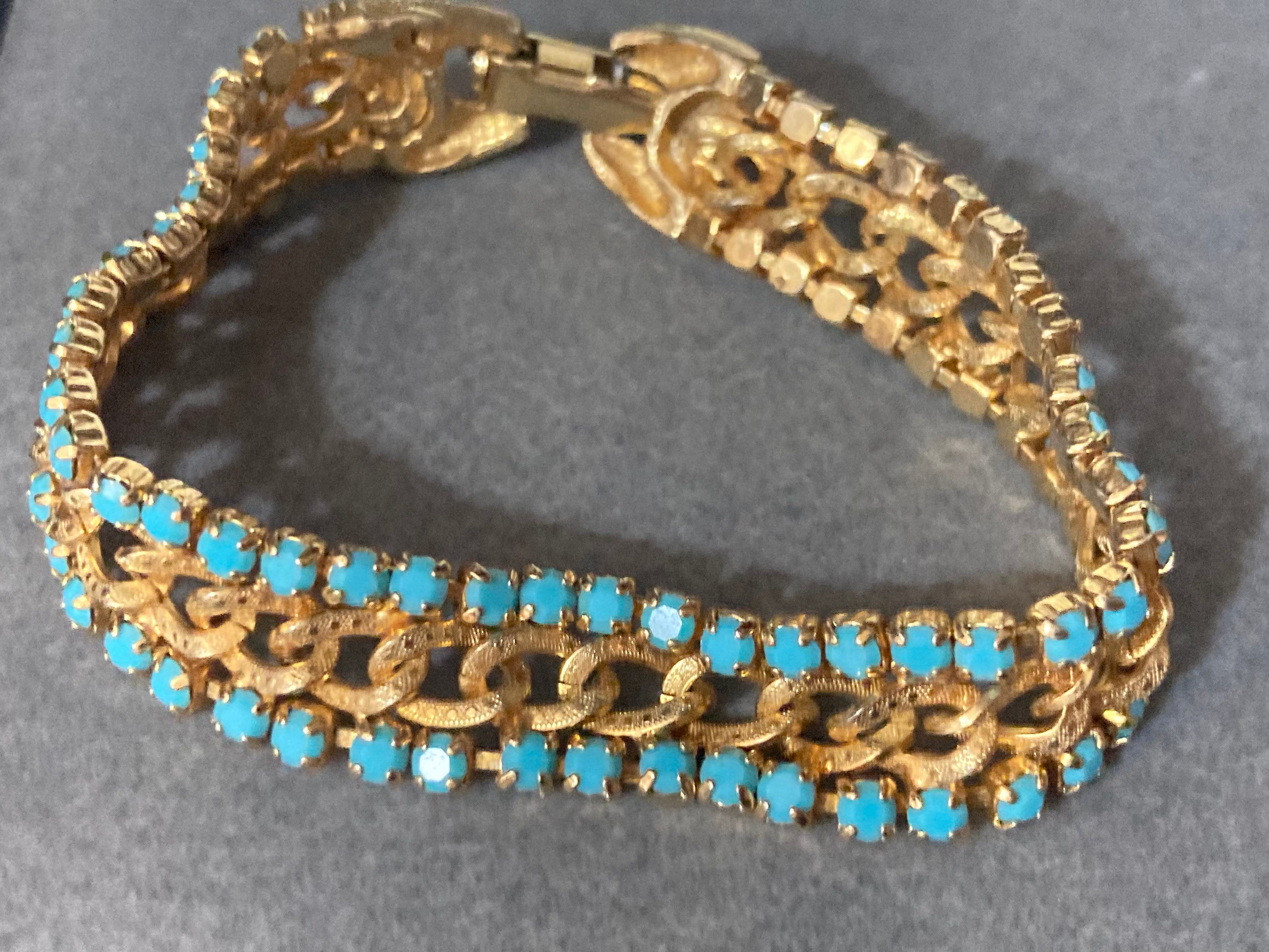 Vintage articulated flat link mesh gold tone bracelet with turquoise blue paste