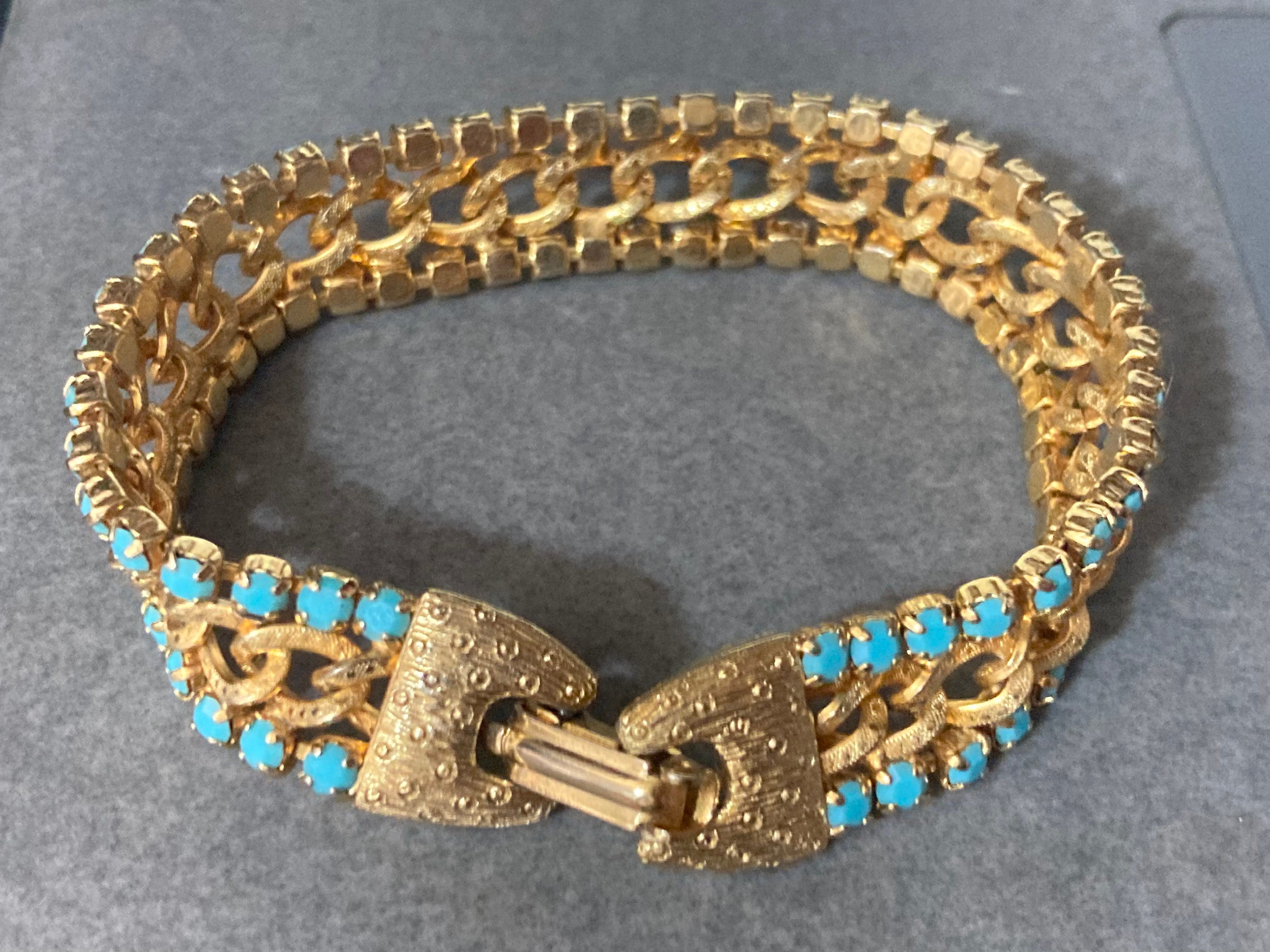 Vintage articulated flat link mesh gold tone bracelet with turquoise blue paste
