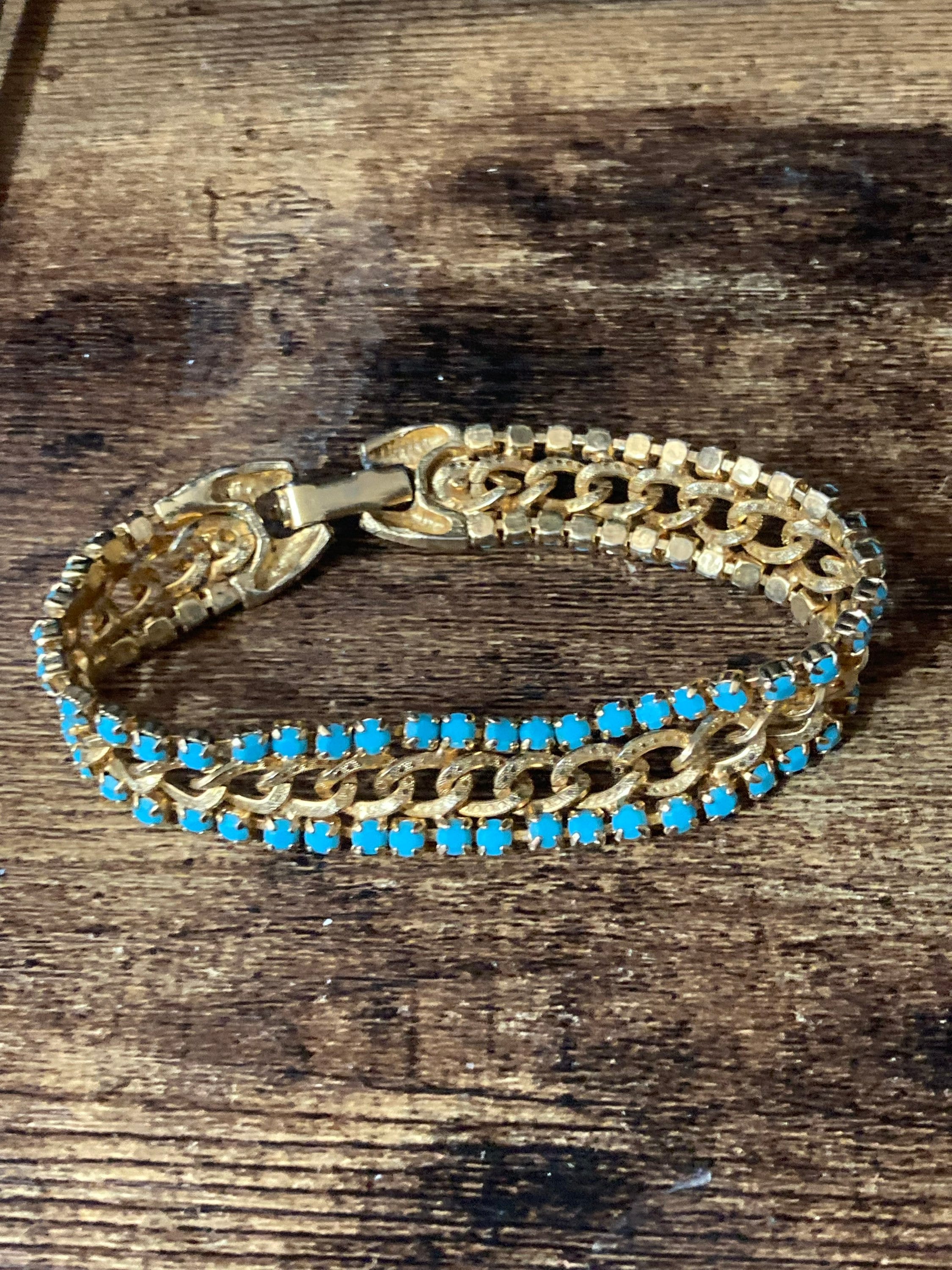 Vintage articulated flat link mesh gold tone bracelet with turquoise blue paste