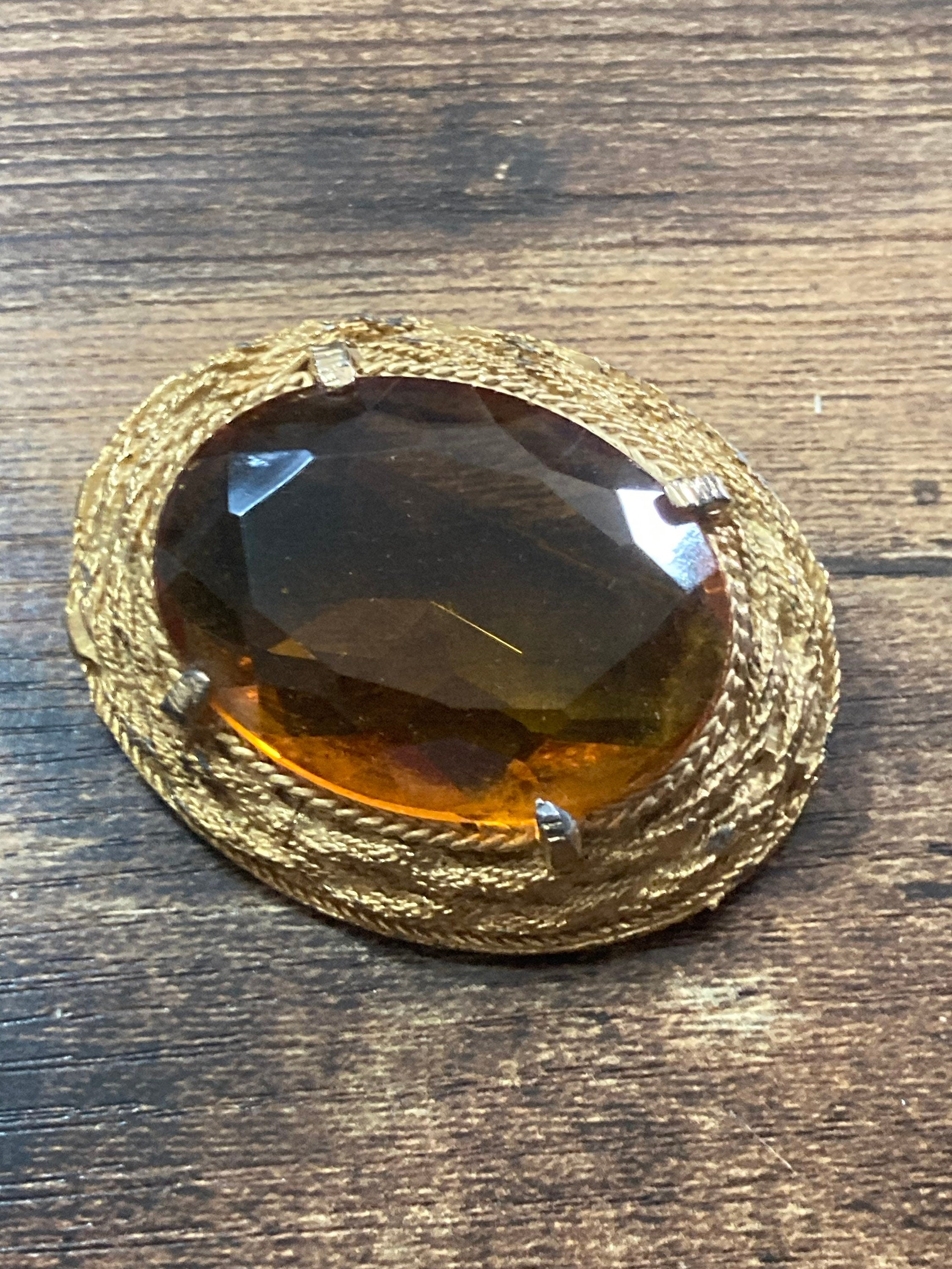 Vintage oversized chunky gold tone brooch with large orange citrine glass cabochon