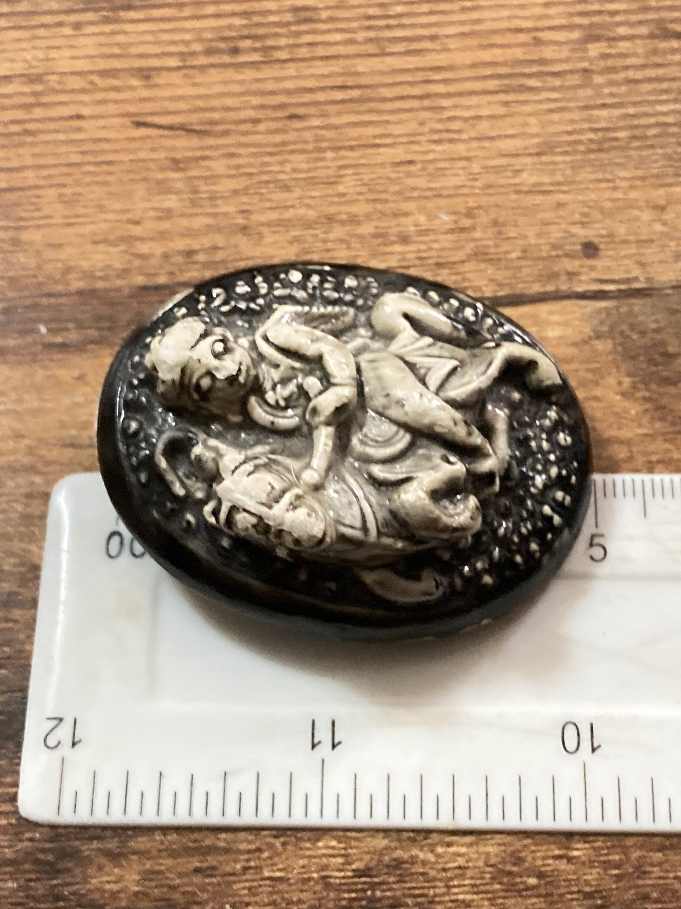 Early Plastic Celluloid Art Deco large Oval man on horse relief brooch St George