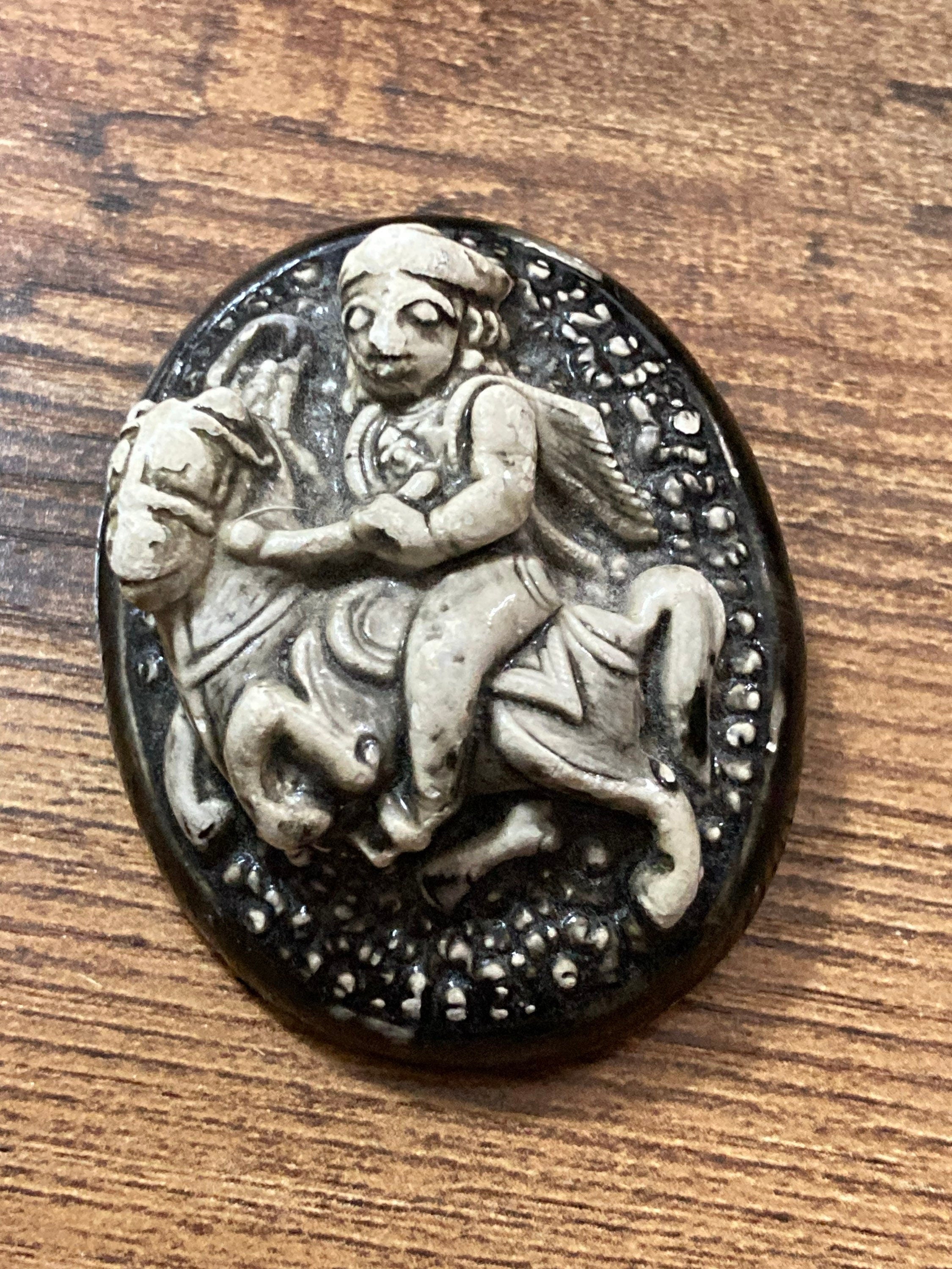 Early Plastic Celluloid Art Deco large Oval man on horse relief brooch St George