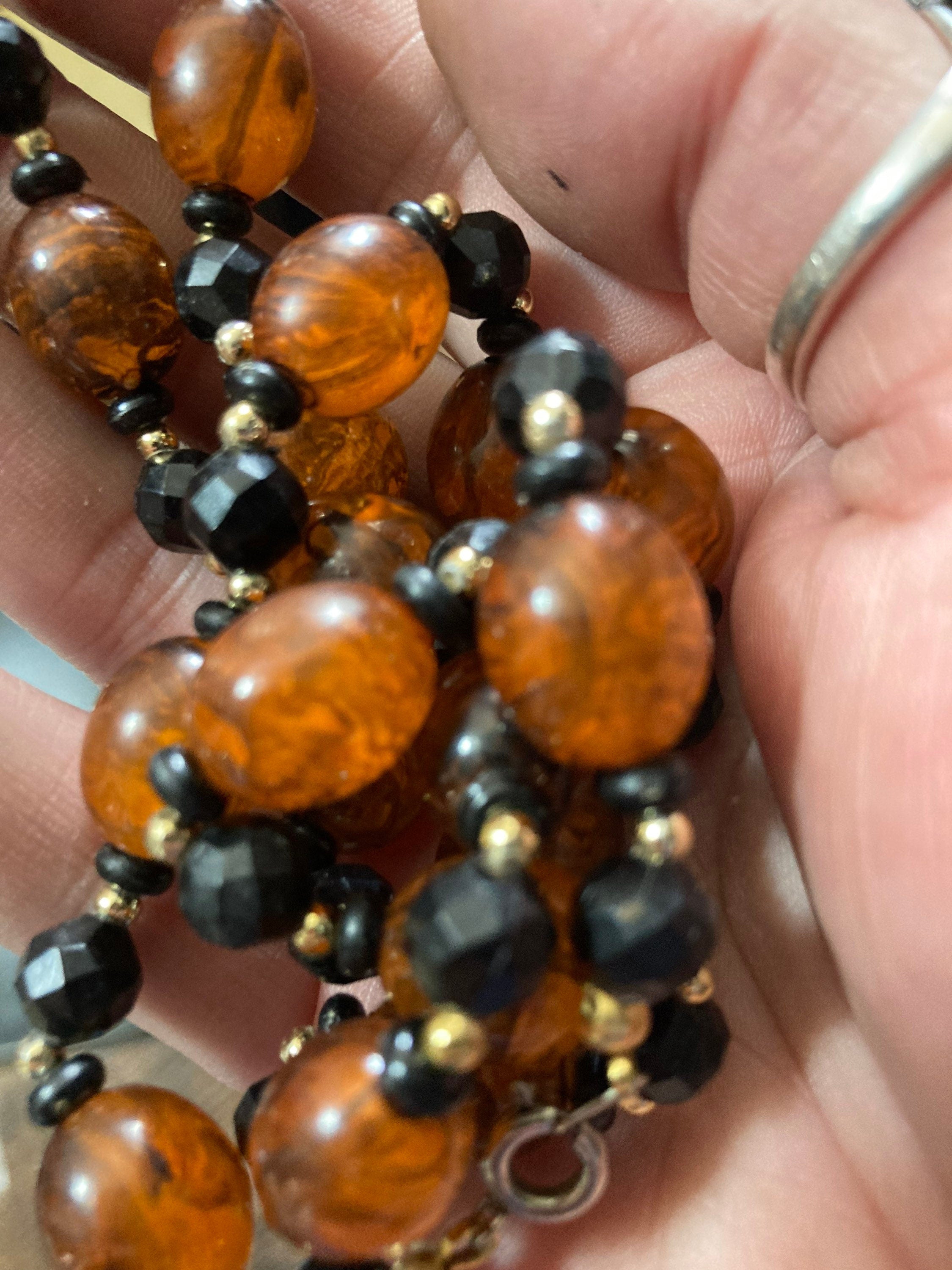 Retro faux amber orange brown  plastic beaded long necklace with black beads