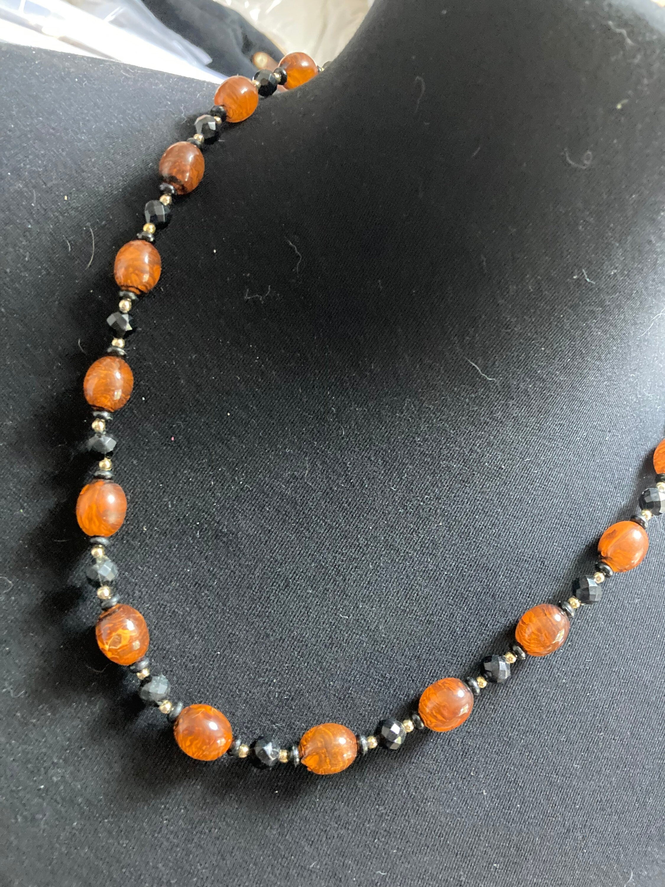 Retro faux amber orange brown  plastic beaded long necklace with black beads