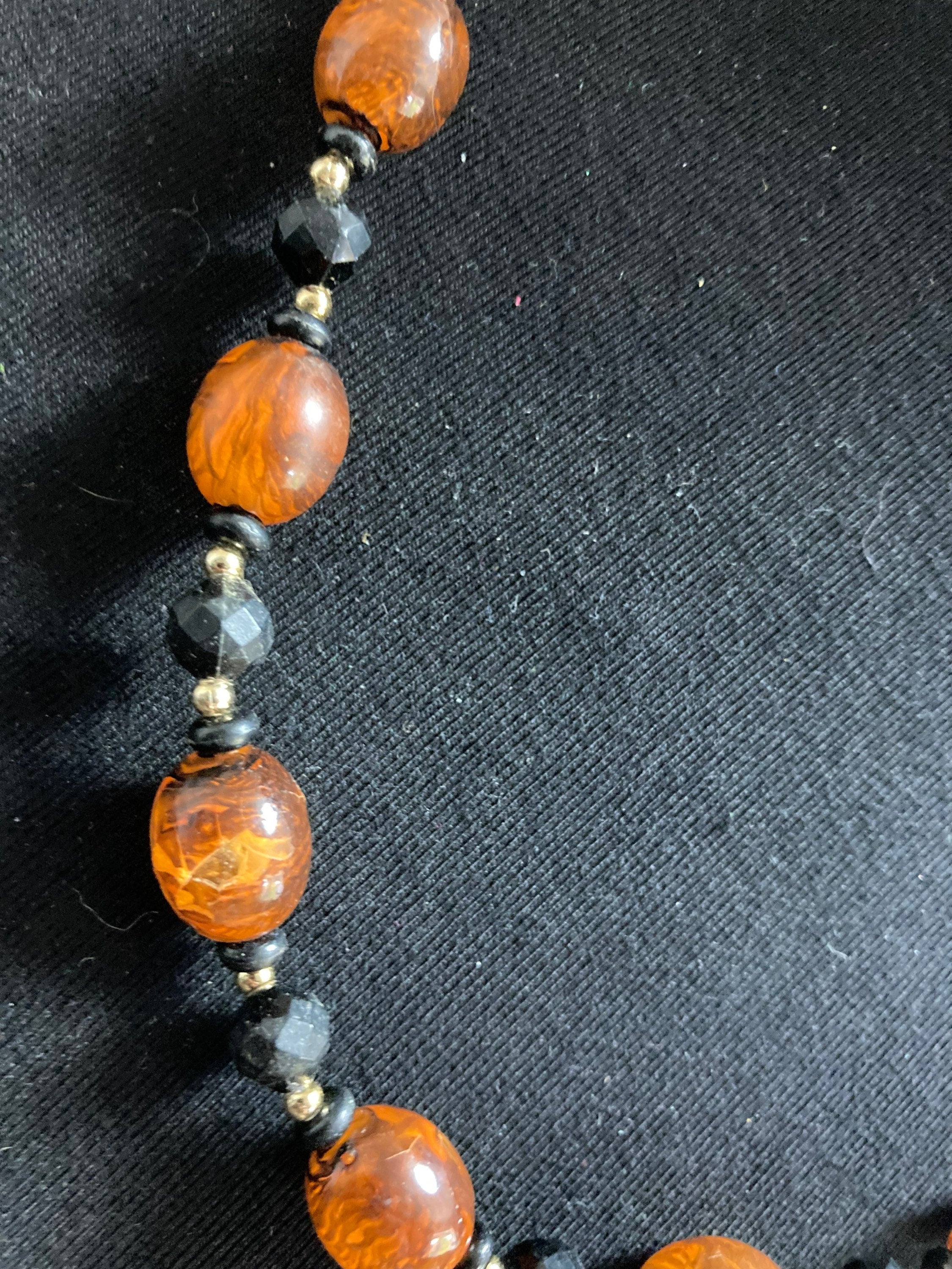 Retro faux amber orange brown  plastic beaded long necklace with black beads