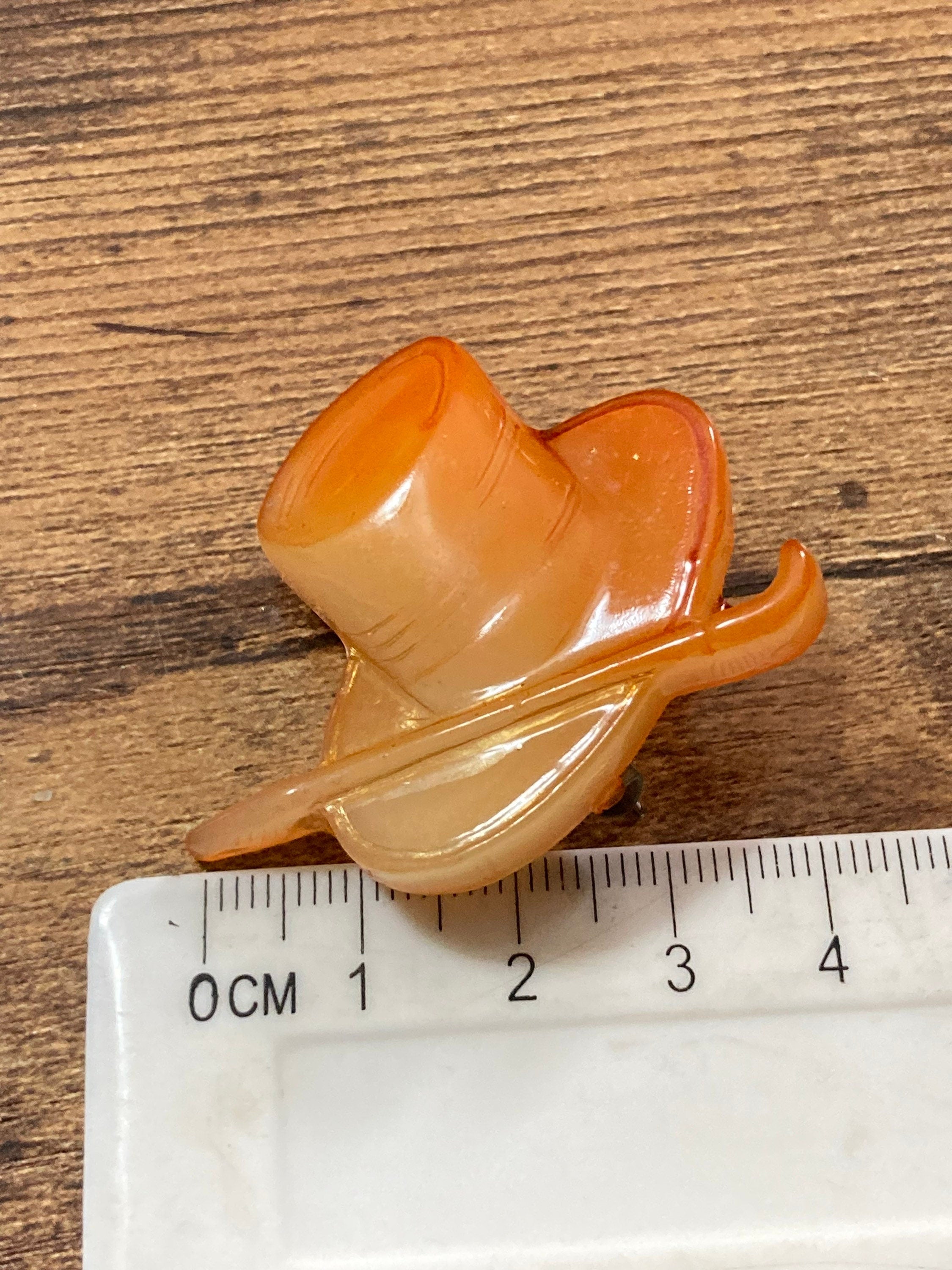 Early Plastic Celluloid Art Deco orange mens top hat and cane brooch