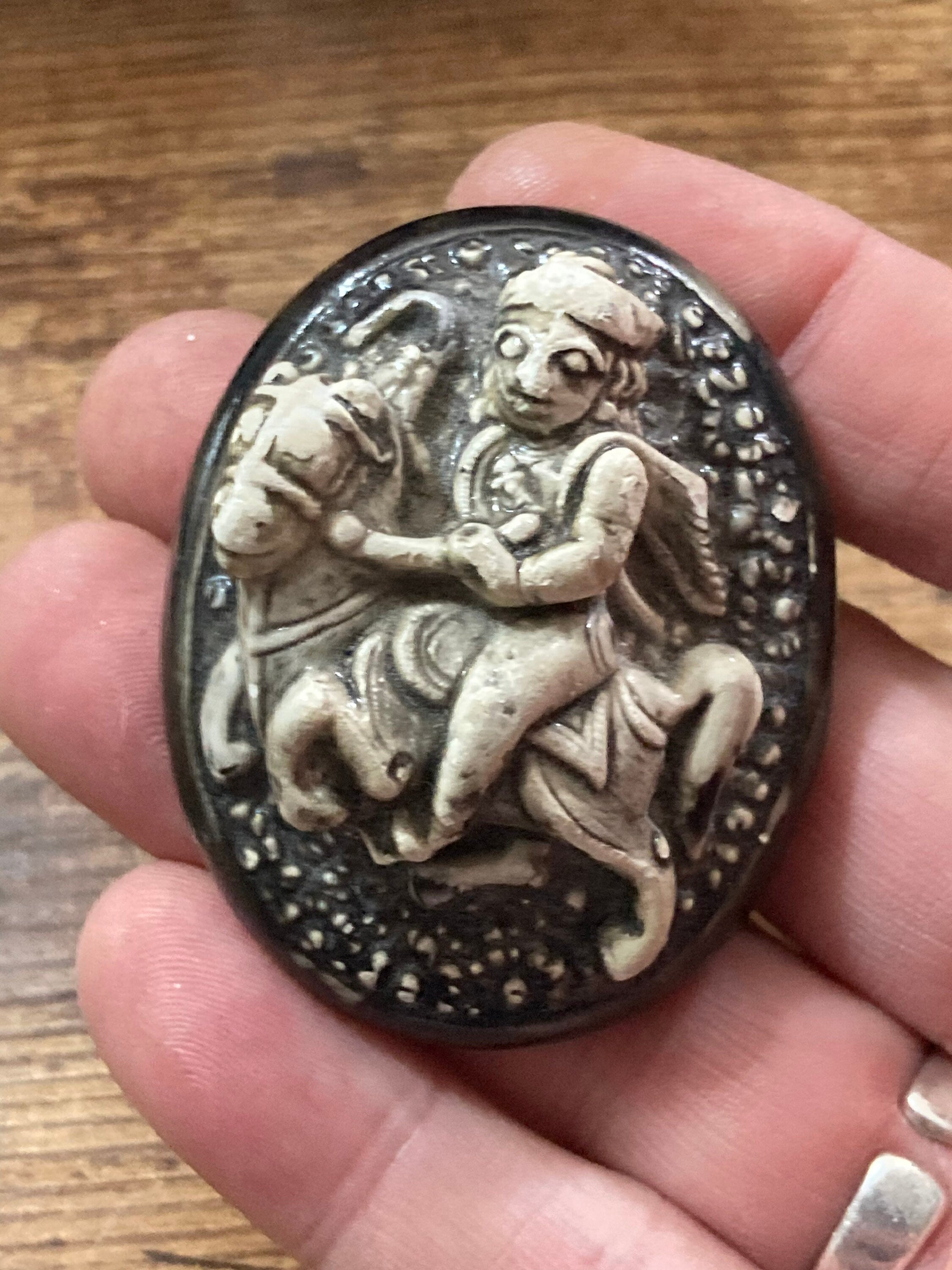 Early Plastic Celluloid Art Deco large Oval man on horse relief brooch St George