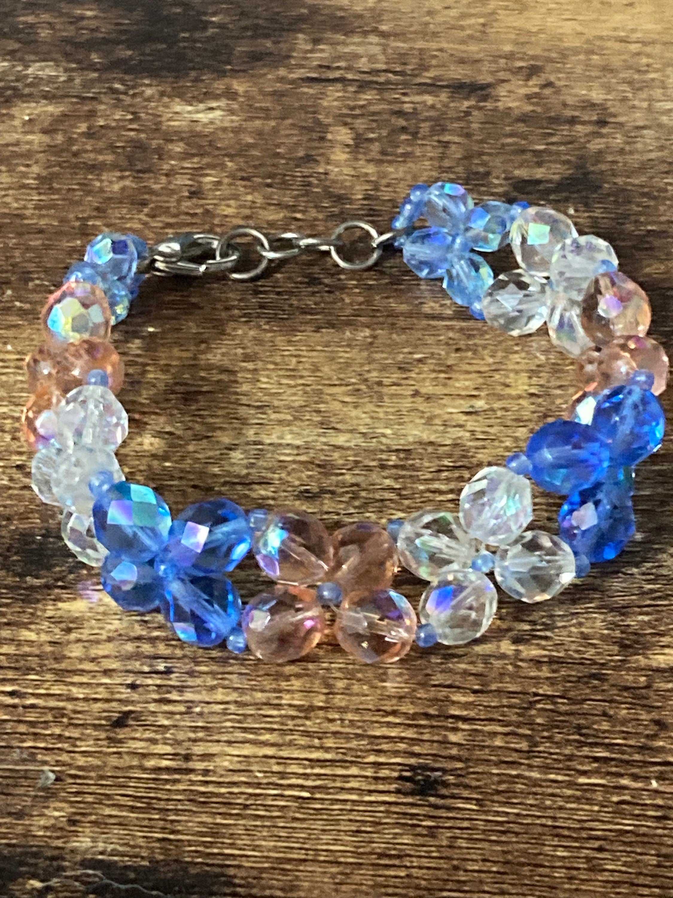 Beautiful 3 row wide blue pink clear AB hues face red glass crystal beaded bracelet perfect for layering