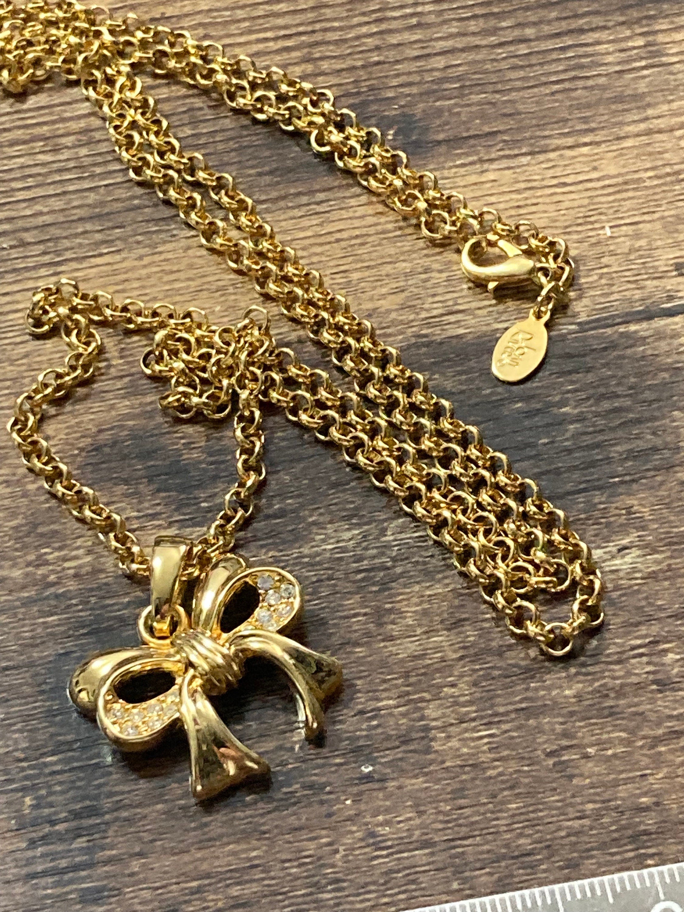 Signed Joan Rivers gold plated clear diamanté bow pendant necklace
