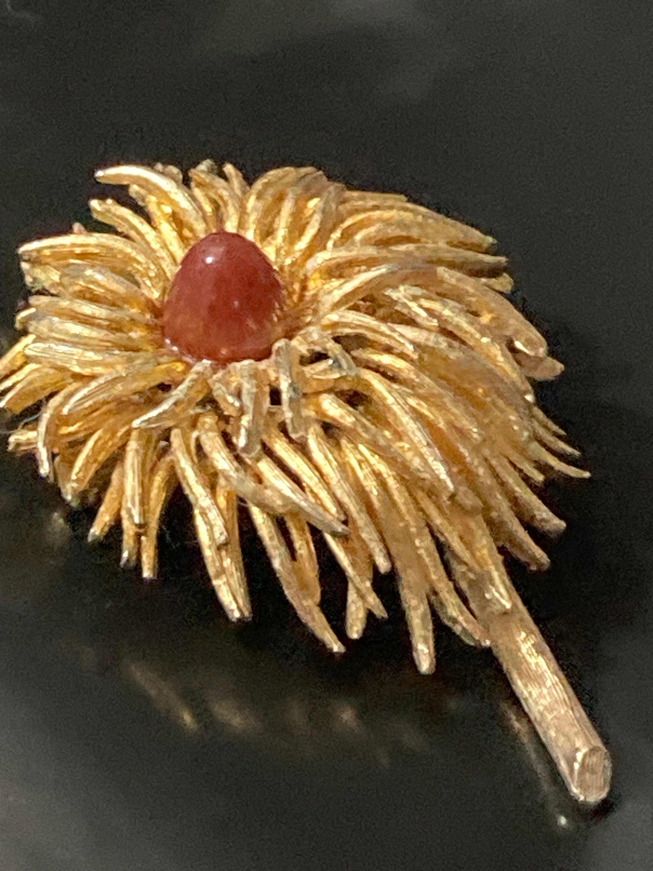 modernist anemone flower brooch with central carnelian glass cabochon