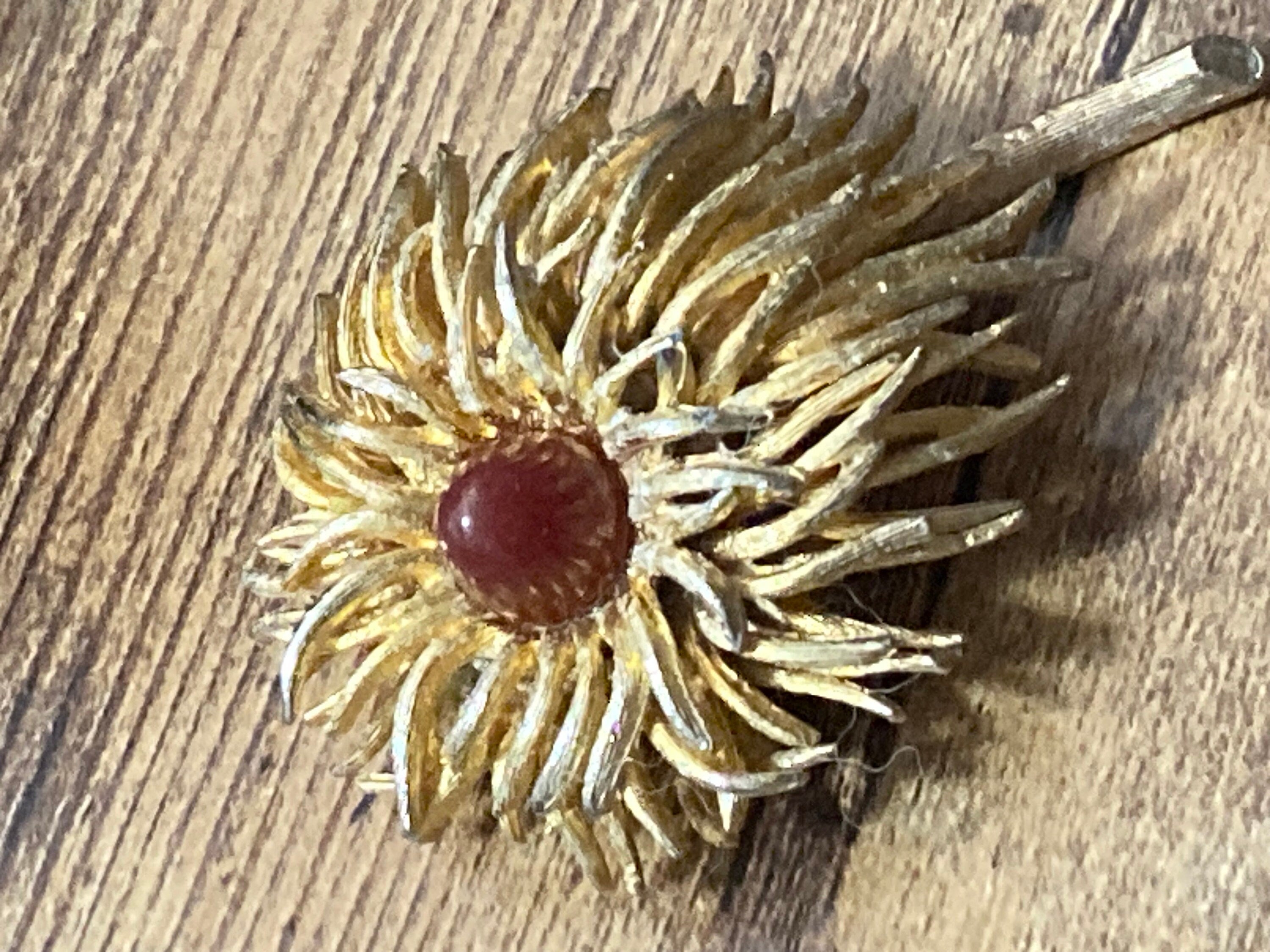 modernist anemone flower brooch with central carnelian glass cabochon