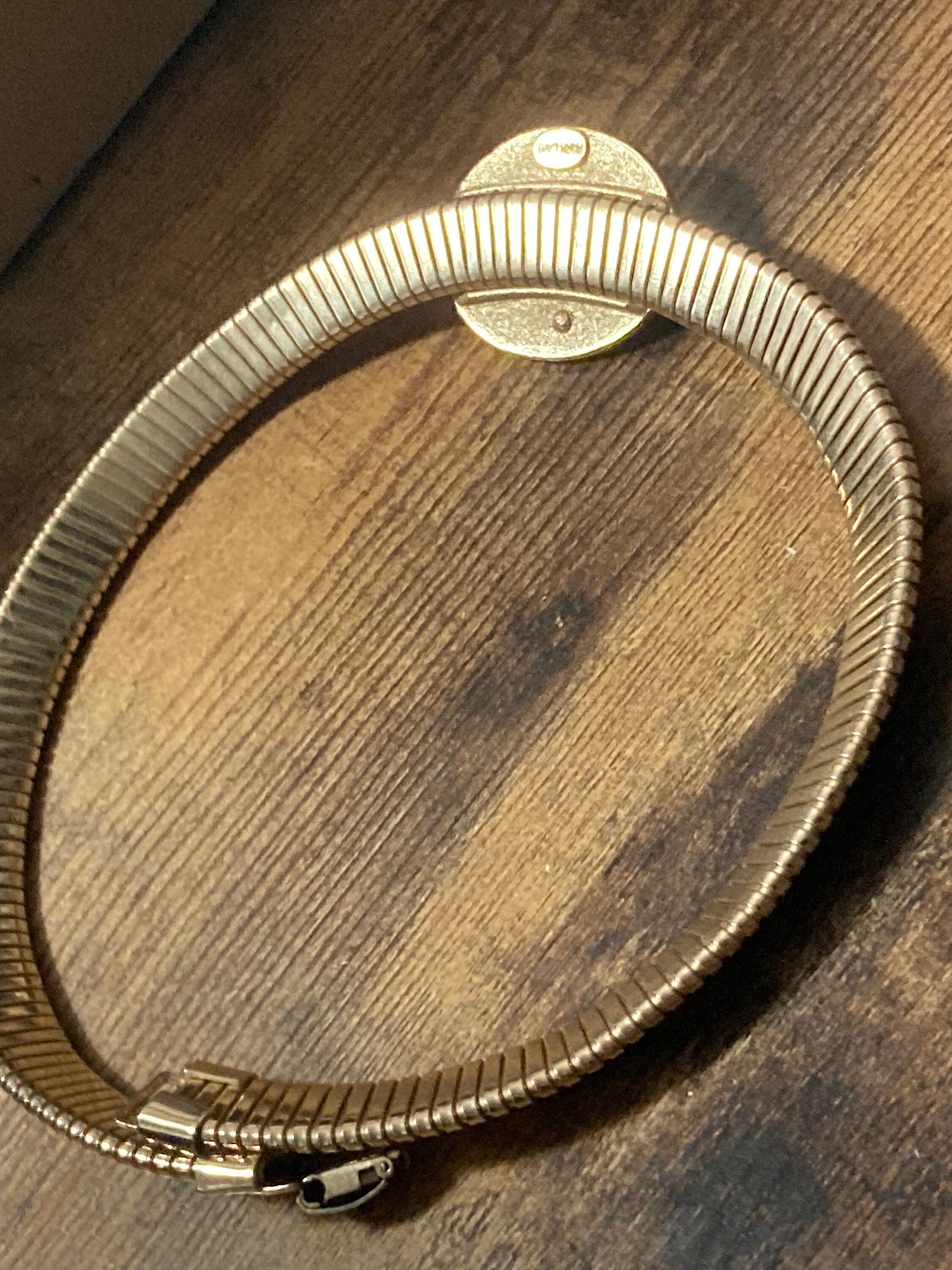 Signed park lane Gold tone omega choker necklace with black Oval diamanté cabochon