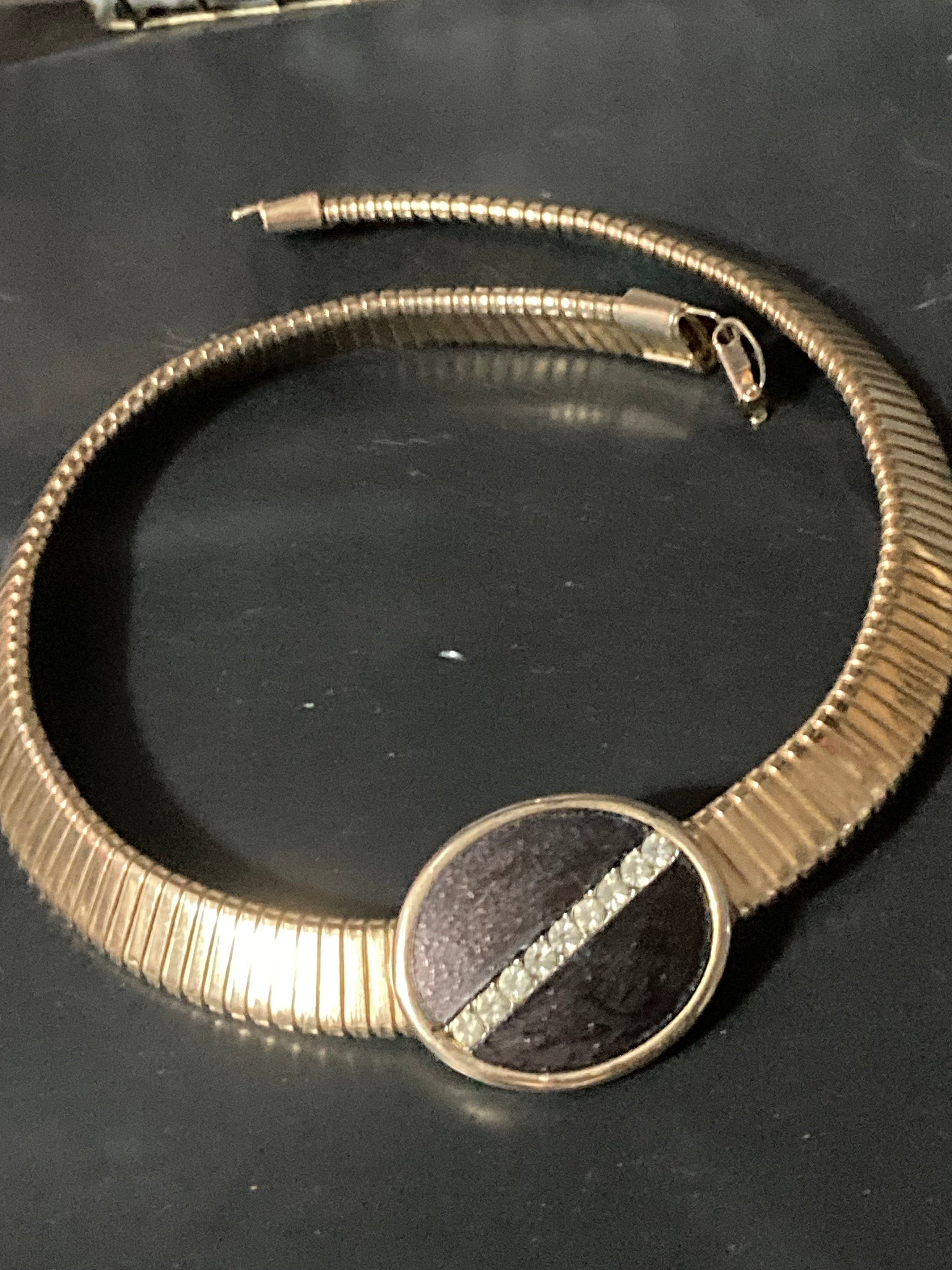 Signed park lane Gold tone omega choker necklace with black Oval diamanté cabochon