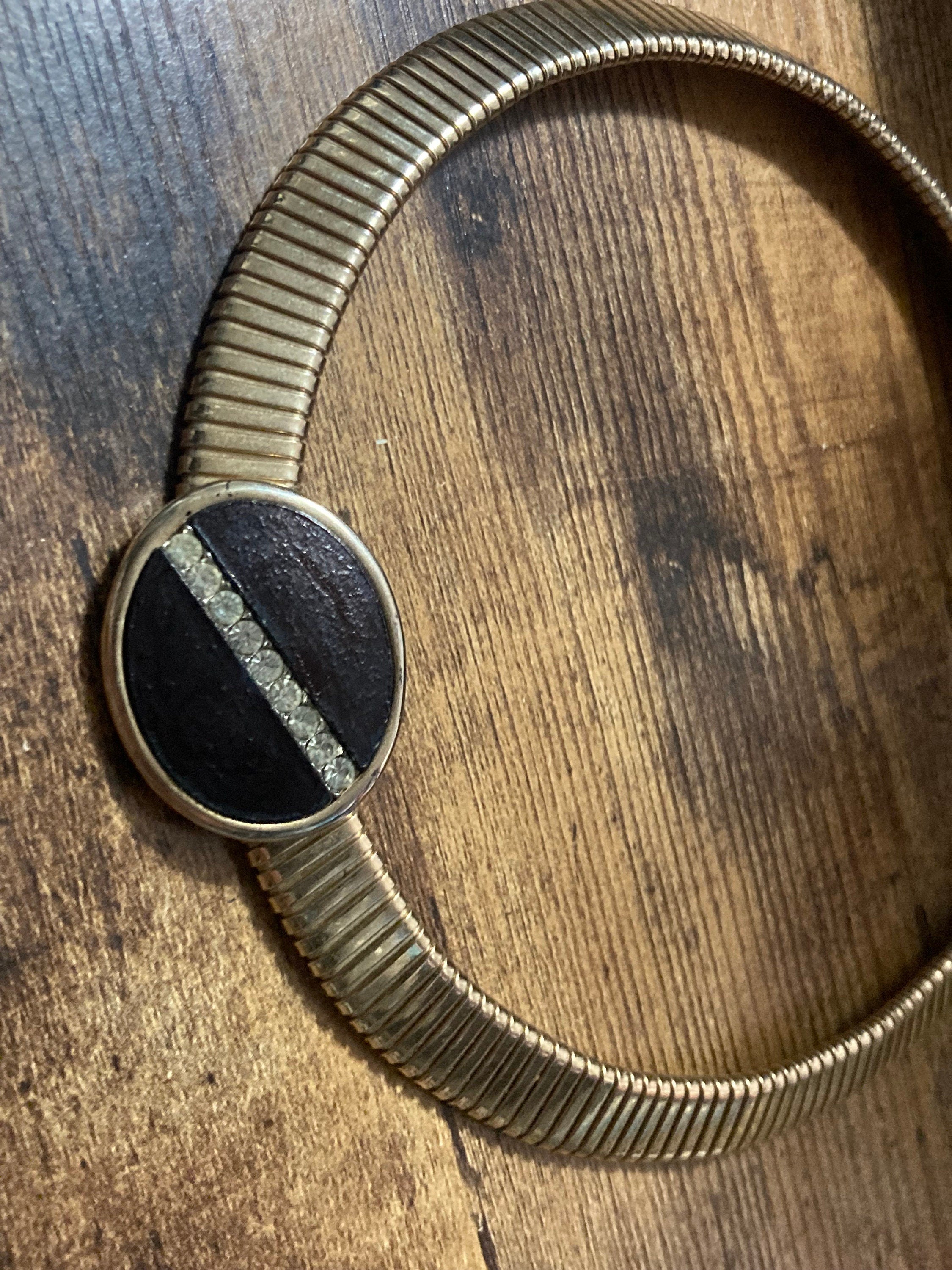 Signed park lane Gold tone omega choker necklace with black Oval diamanté cabochon