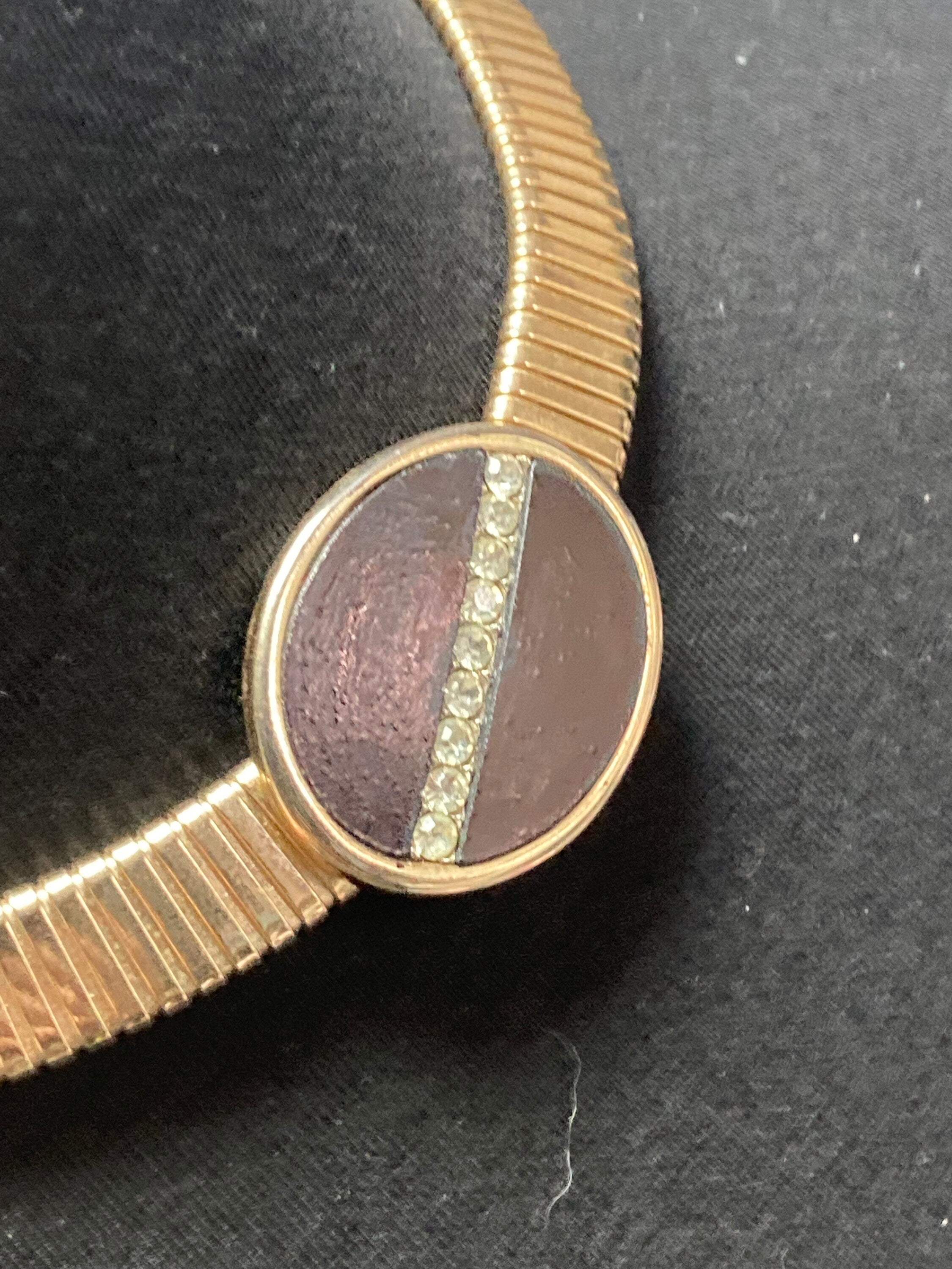 Signed park lane Gold tone omega choker necklace with black Oval diamanté cabochon