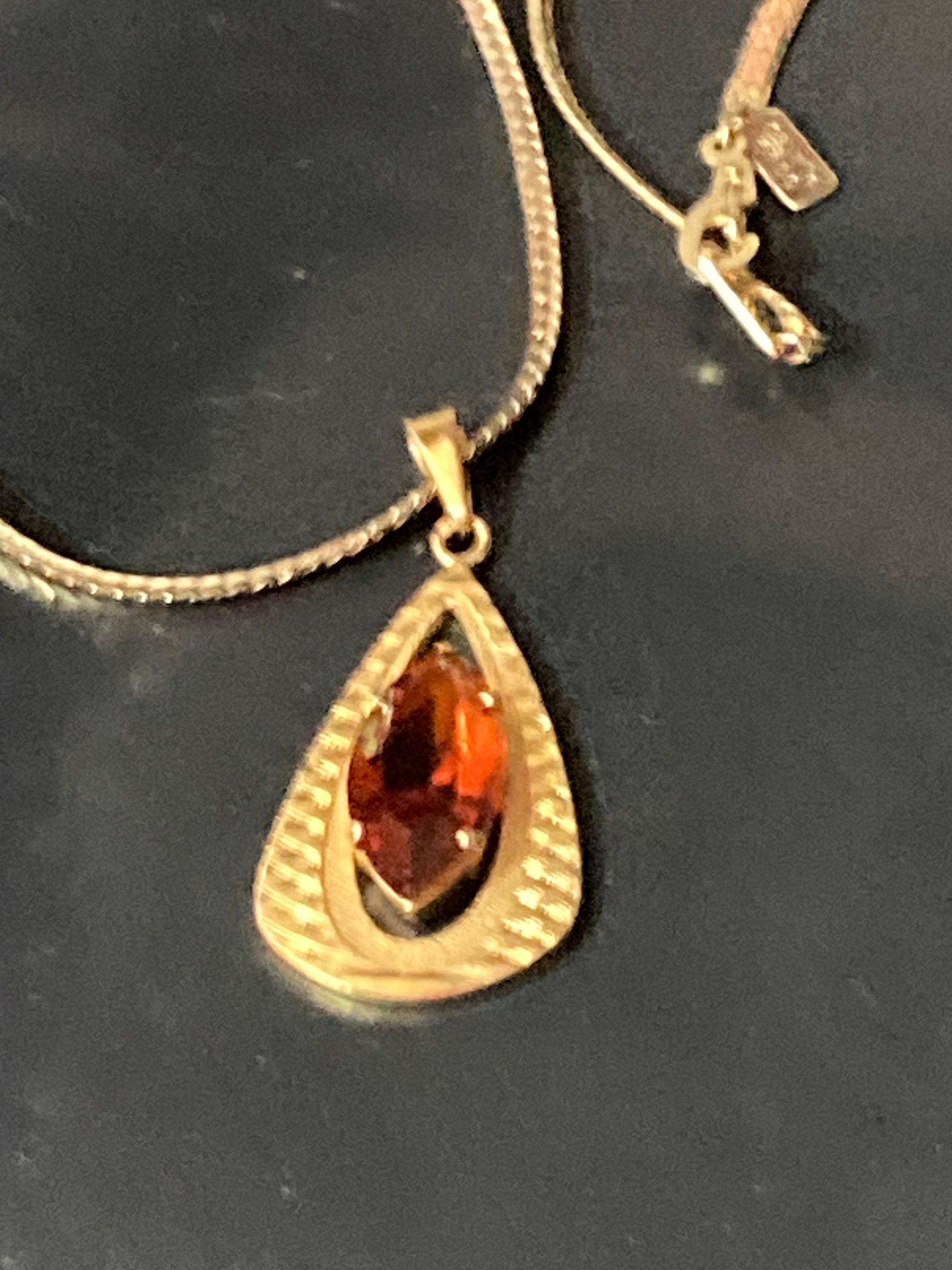 orange faux amber faceted Glass pendant on 40cm gold plated chain Vintage