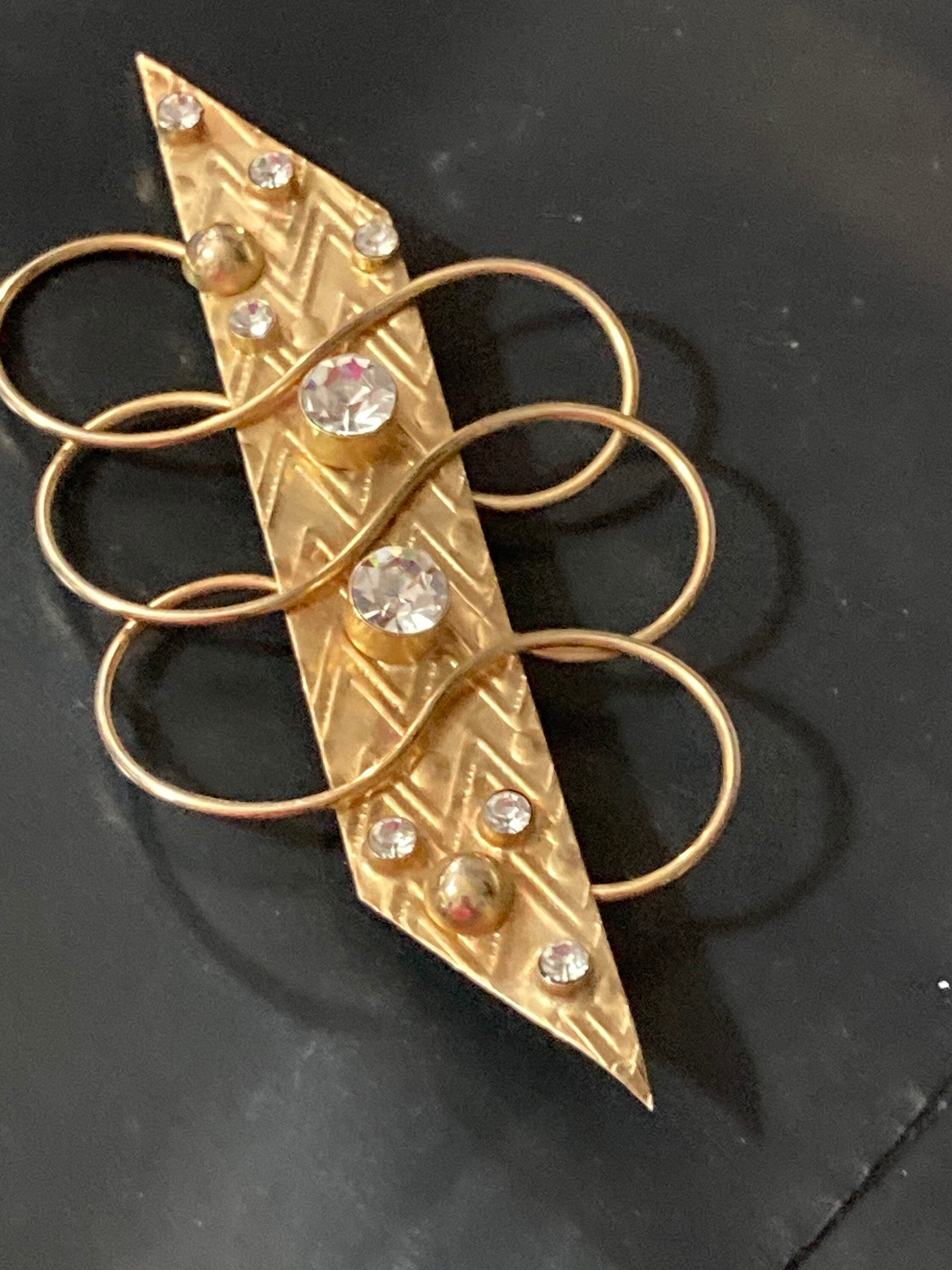 10cm oversized gold tone modernist bar brooch with clear diamanté stones