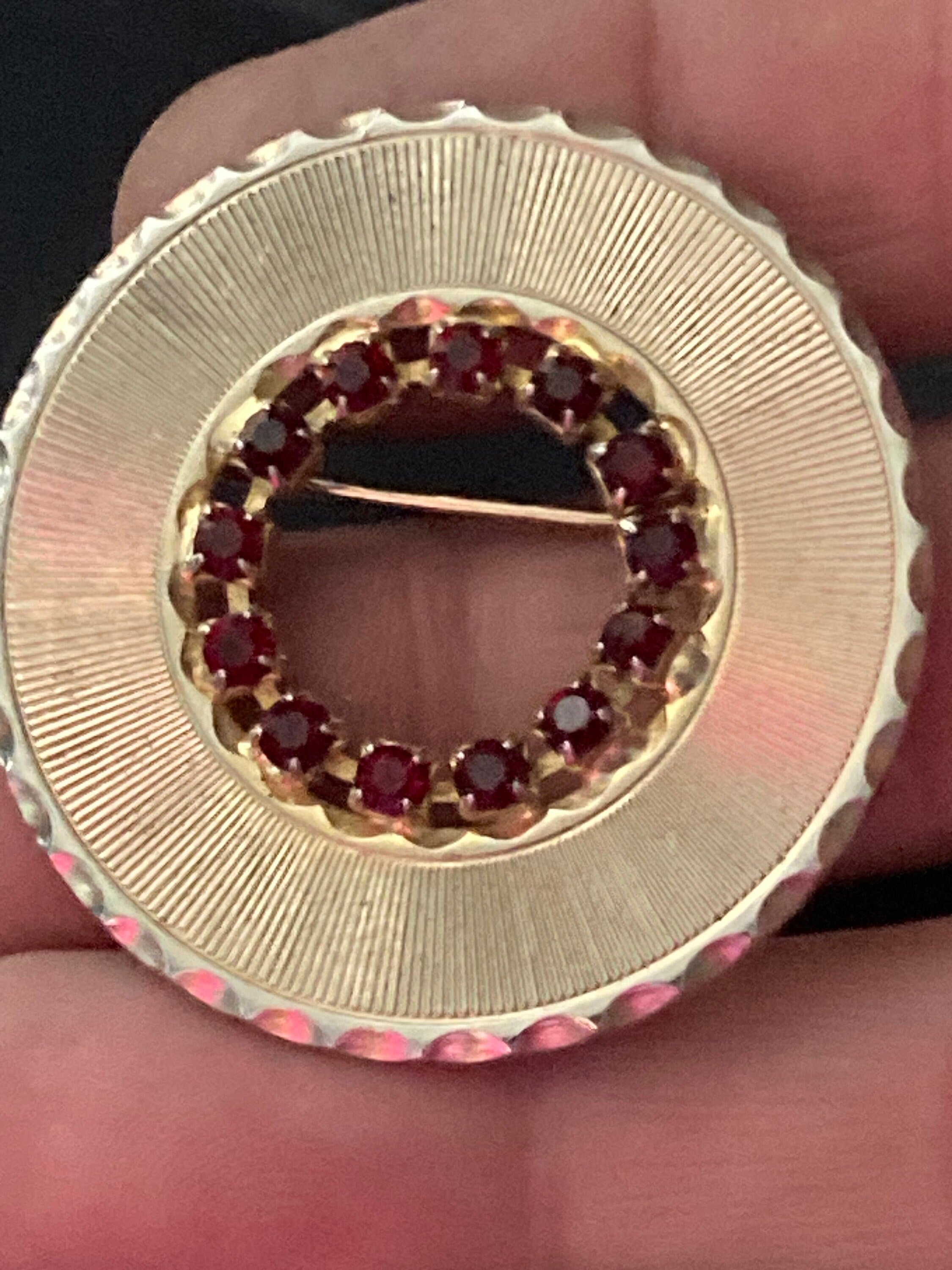 Vintage gold tone faux bohemian ruby garnet paste round mid century brooch