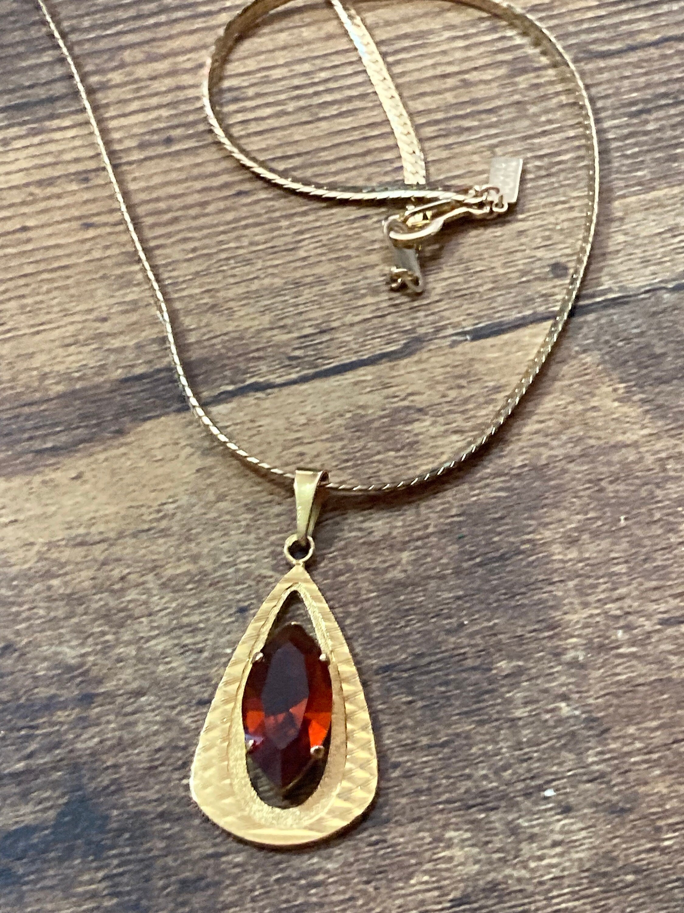 orange faux amber faceted Glass pendant on 40cm gold plated chain Vintage