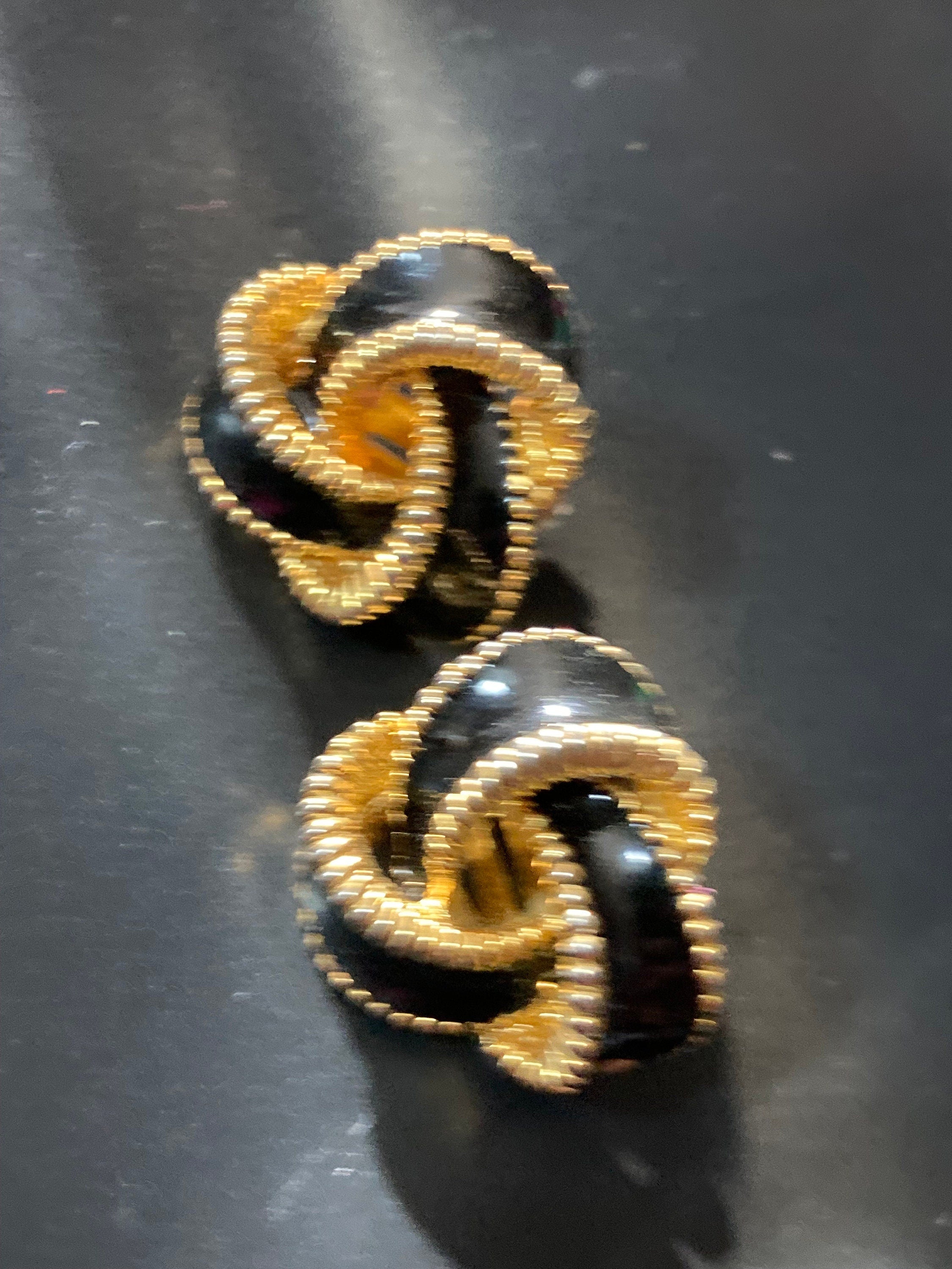Vintage Gold tone black enamel clip on stud knot earrings