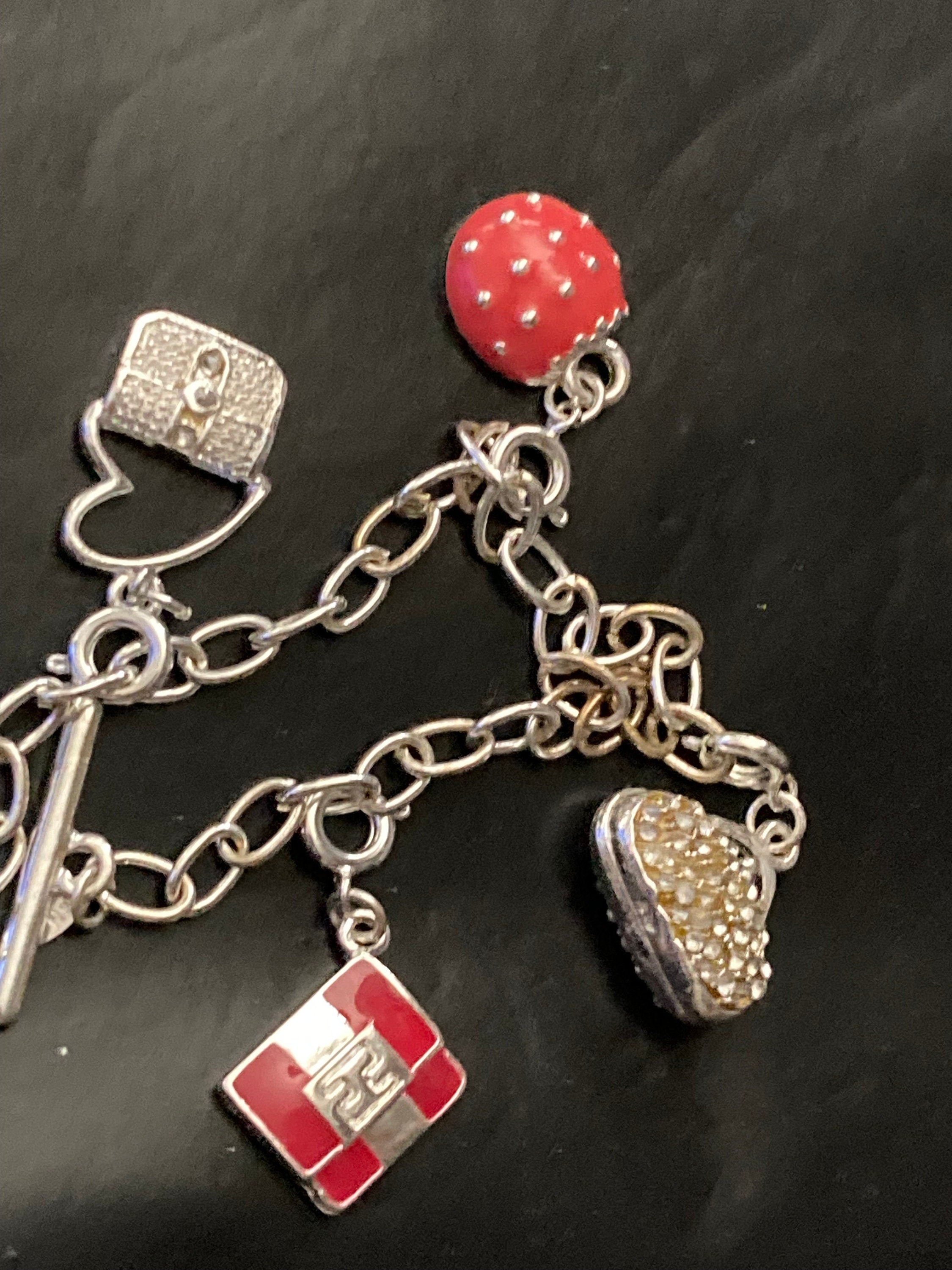 Signed Avon silver tone novelty enamelled handbag purses charm bracelet 19cm