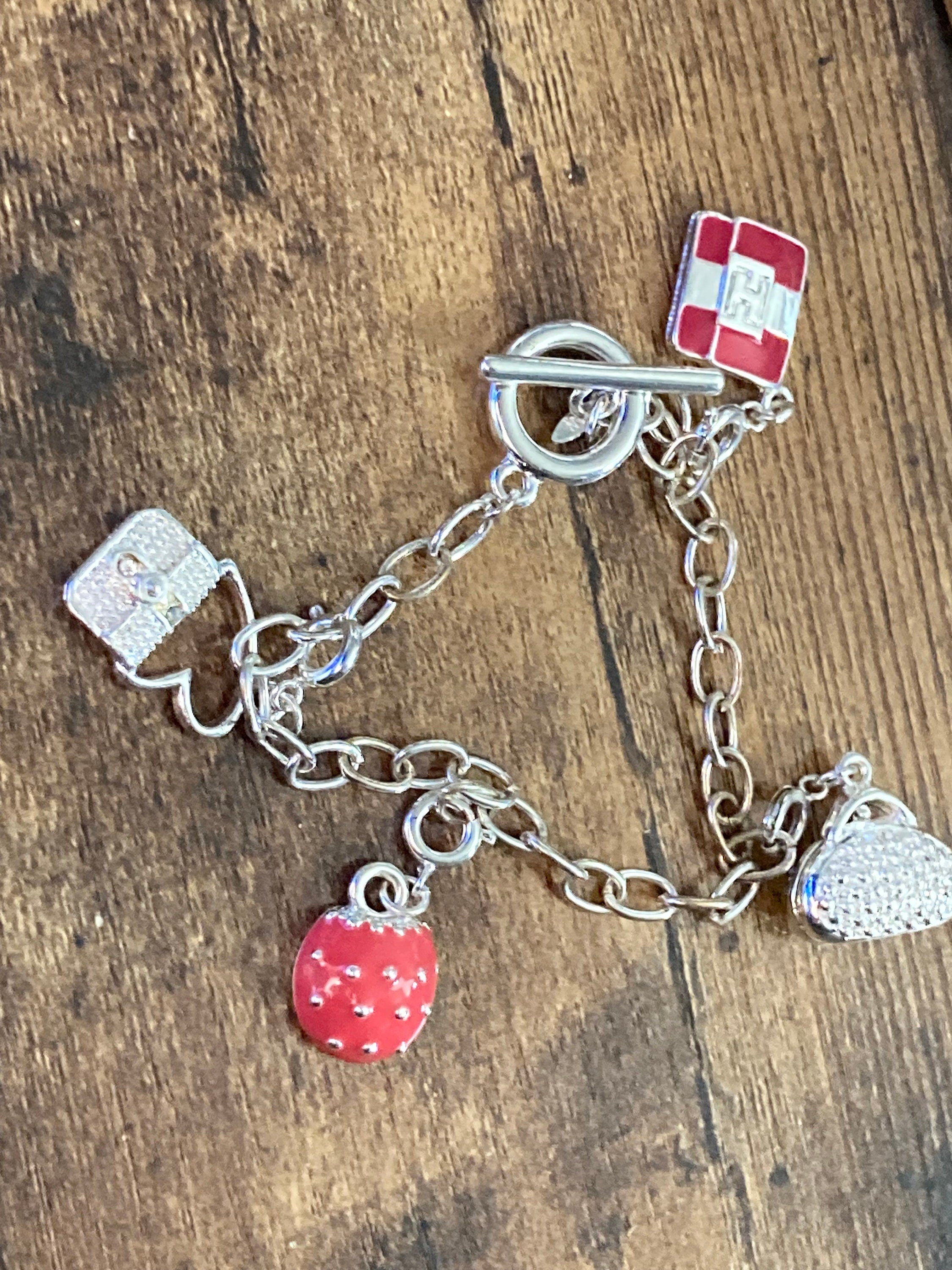 Signed Avon silver tone novelty enamelled handbag purses charm bracelet 19cm