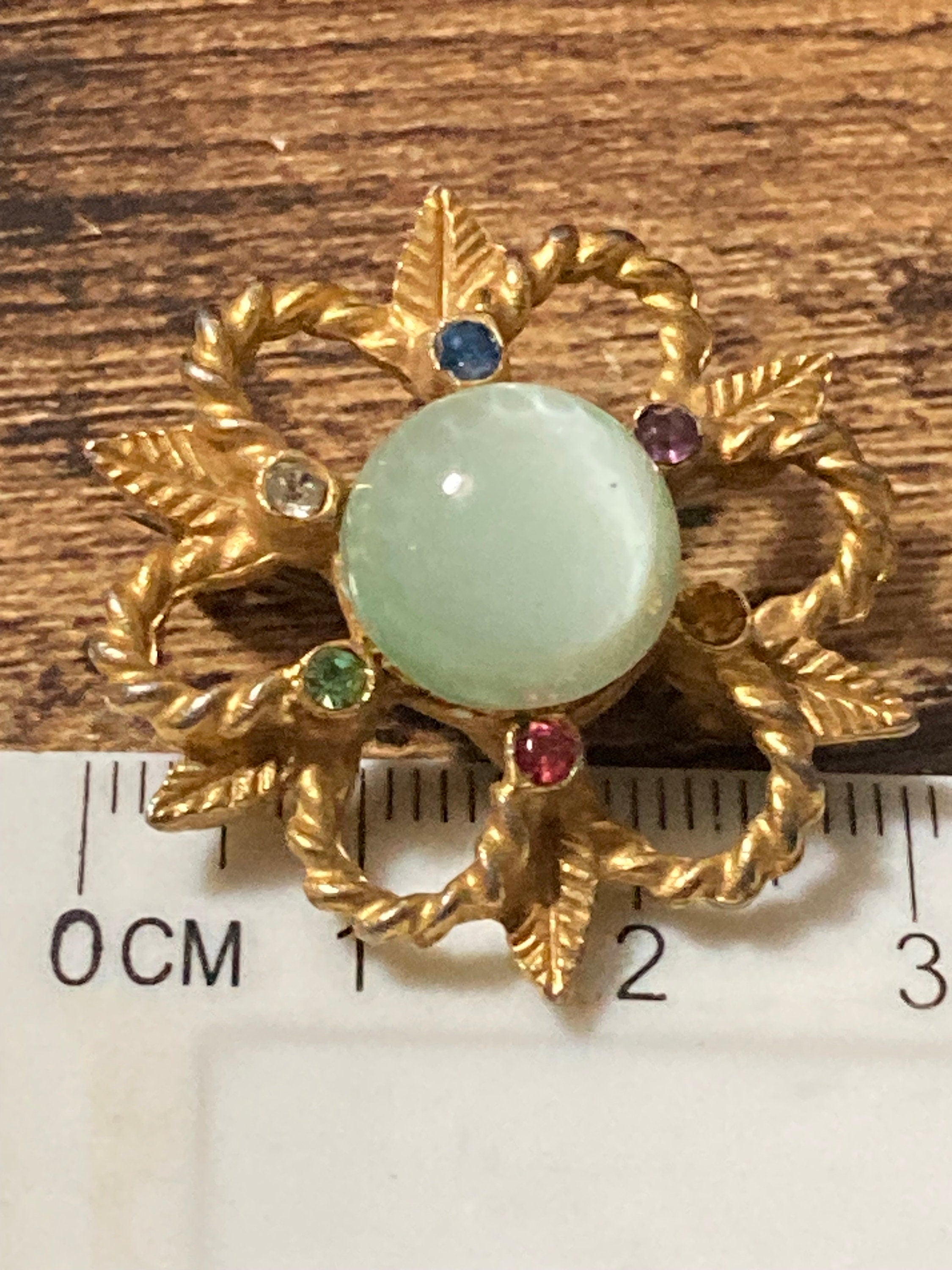 Small art deco rainbow diamanté paste and soft green cabochon brooch 3cm