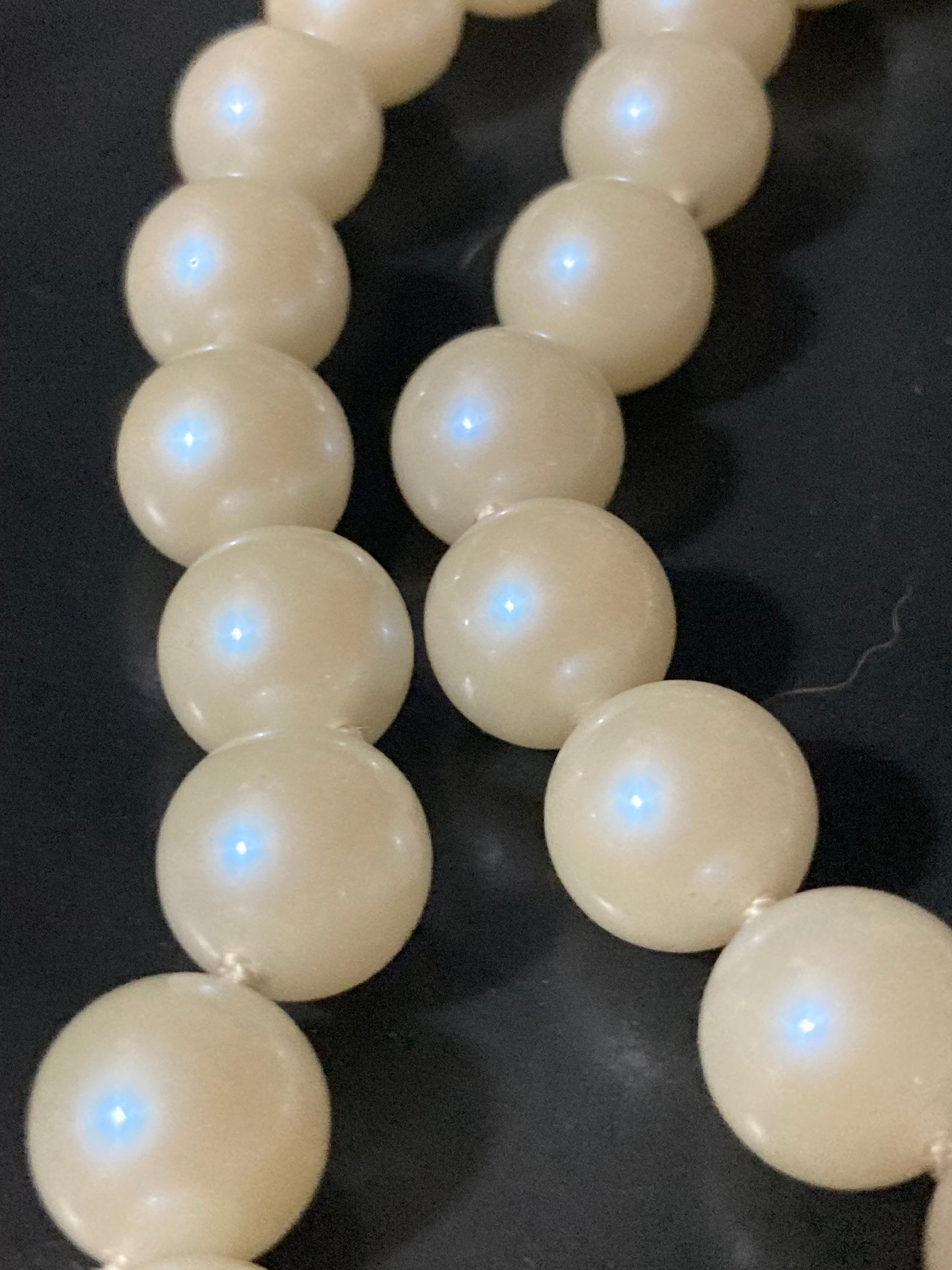 Vintage white faux pearl double strand necklace with emerald paste clasp