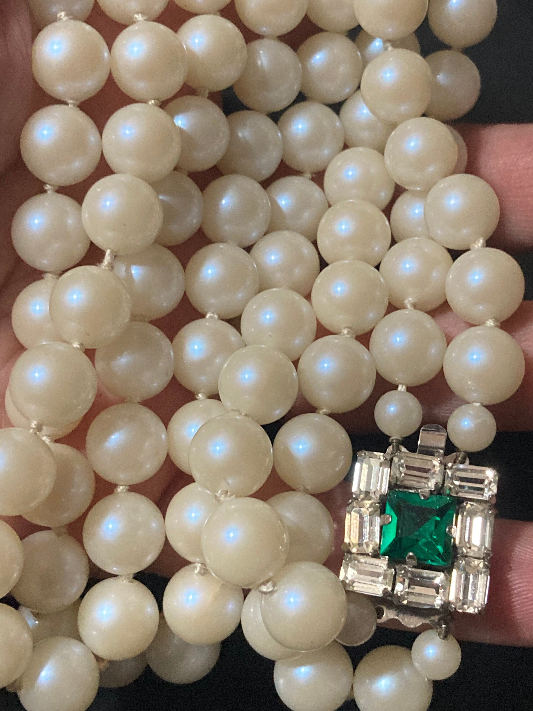 Vintage white faux pearl double strand necklace with emerald paste clasp