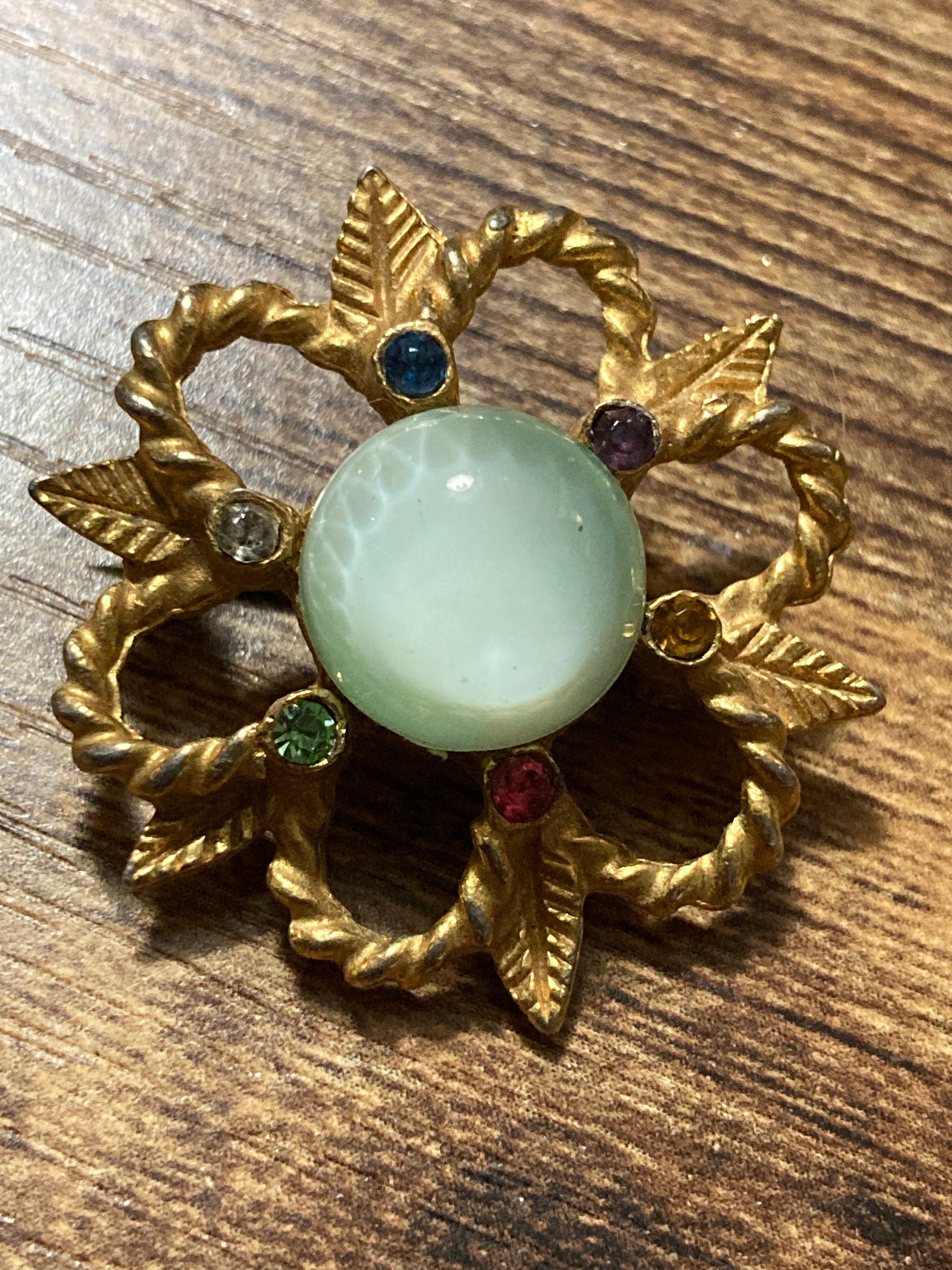 Small art deco rainbow diamanté paste and soft green cabochon brooch 3cm