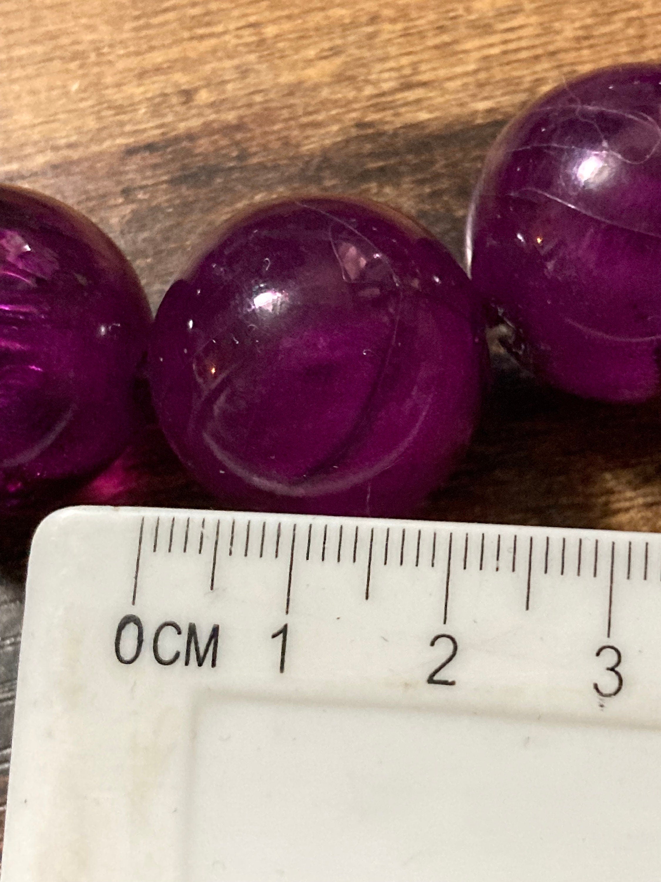 Oversized plastic beaded necklace purple tones