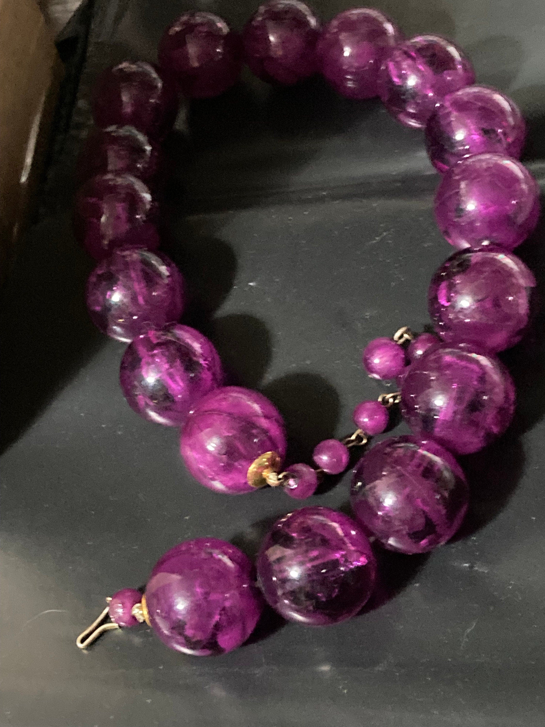 Oversized plastic beaded necklace purple tones