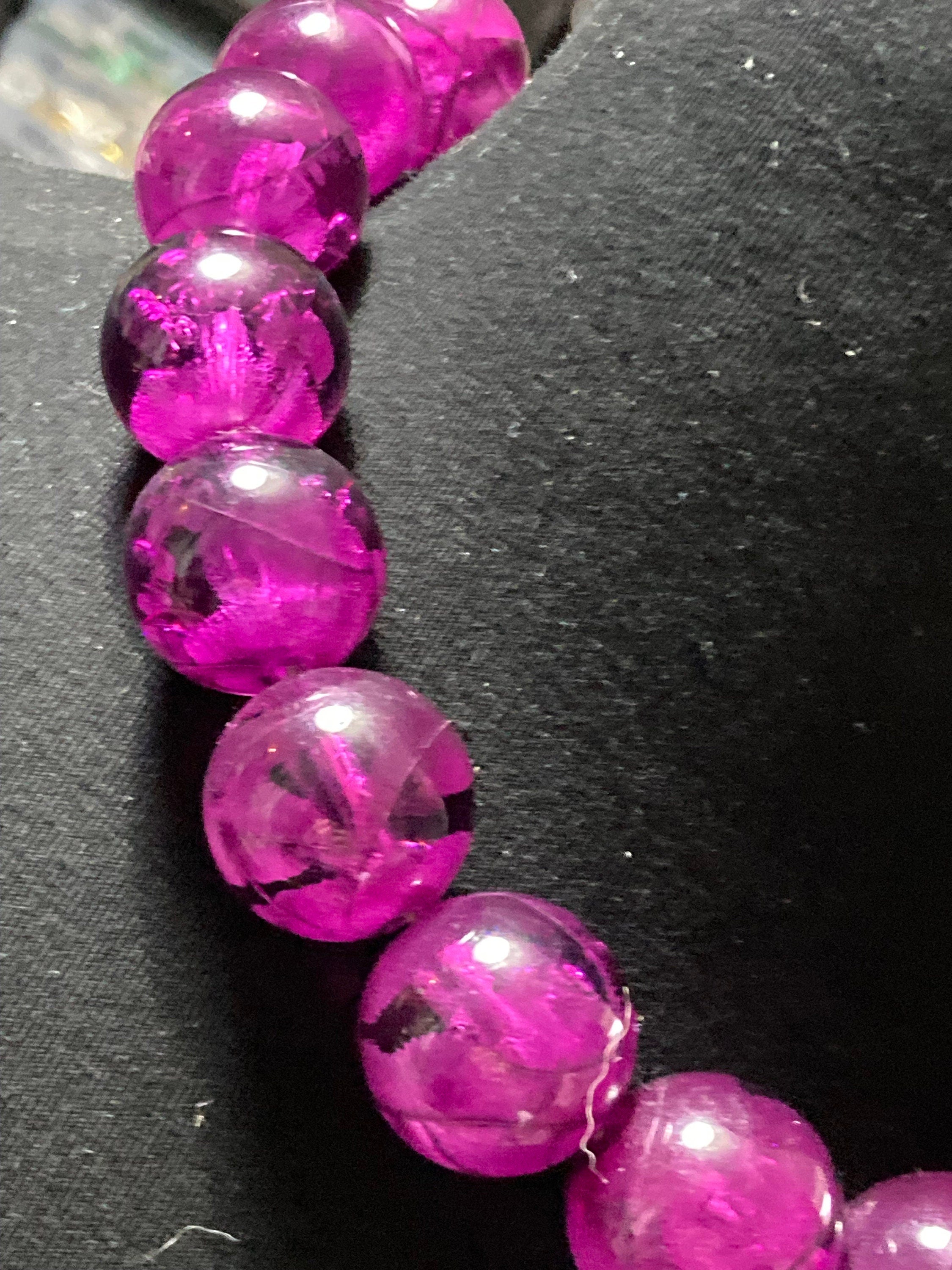 Oversized plastic beaded necklace purple tones